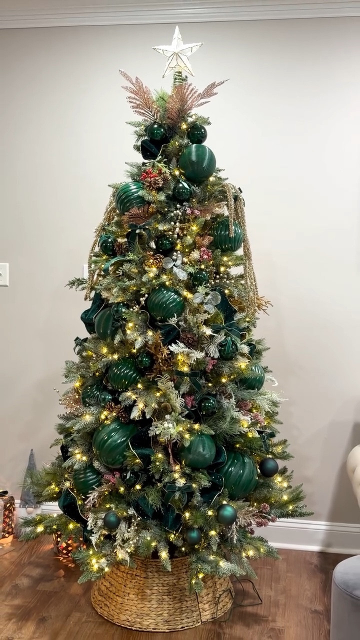 We had so much fun decorating our Christmas tree this year! Emerald green and gold will always be such a classic, elegant combo. I really wanted to try the big-ornament trend, but finding green ones was almost impossible—so I ended up spray-painting a silver one I found at @athome. And of course, after all that, I discovered Walmart carries big ornaments in all kinds of colors and sizes. 😂 If you’re still on the hunt for Christmas décor, definitely check out Walmart or browse my LTK for more festive ideas!