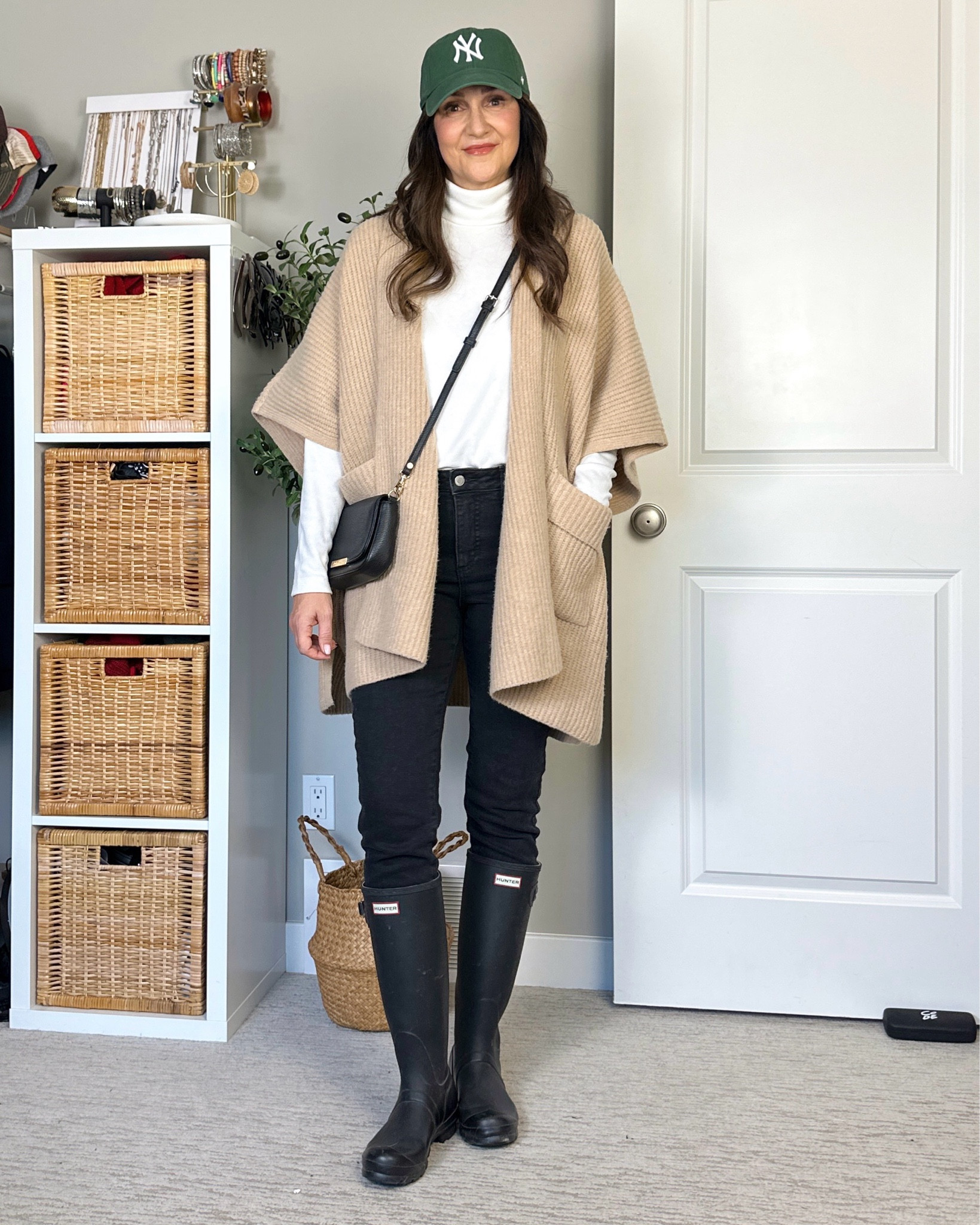 Early spring outfit on a warm winter day! Swap with a regular cardigan and riding or Chelsea boots for winter weather.
I’m 5’ 7” size 4 wearing my usual size 4 in these skinny jeans (wash is “washed black”), S in the fleece turtleneck (I have it in black and burgundy) and I got M in the poncho style cardigan. 
Hunter boots fit a little big and don’t come in half sizes. I’m size 7.5 and these are US 7/EU 38 and I have room for thick socks. 
Also linked my “day to night” bag which can also be worn with a shorter gold chain strap and my cap.


#LTKShoeCrush #LTKStyleTip #LTKItBag