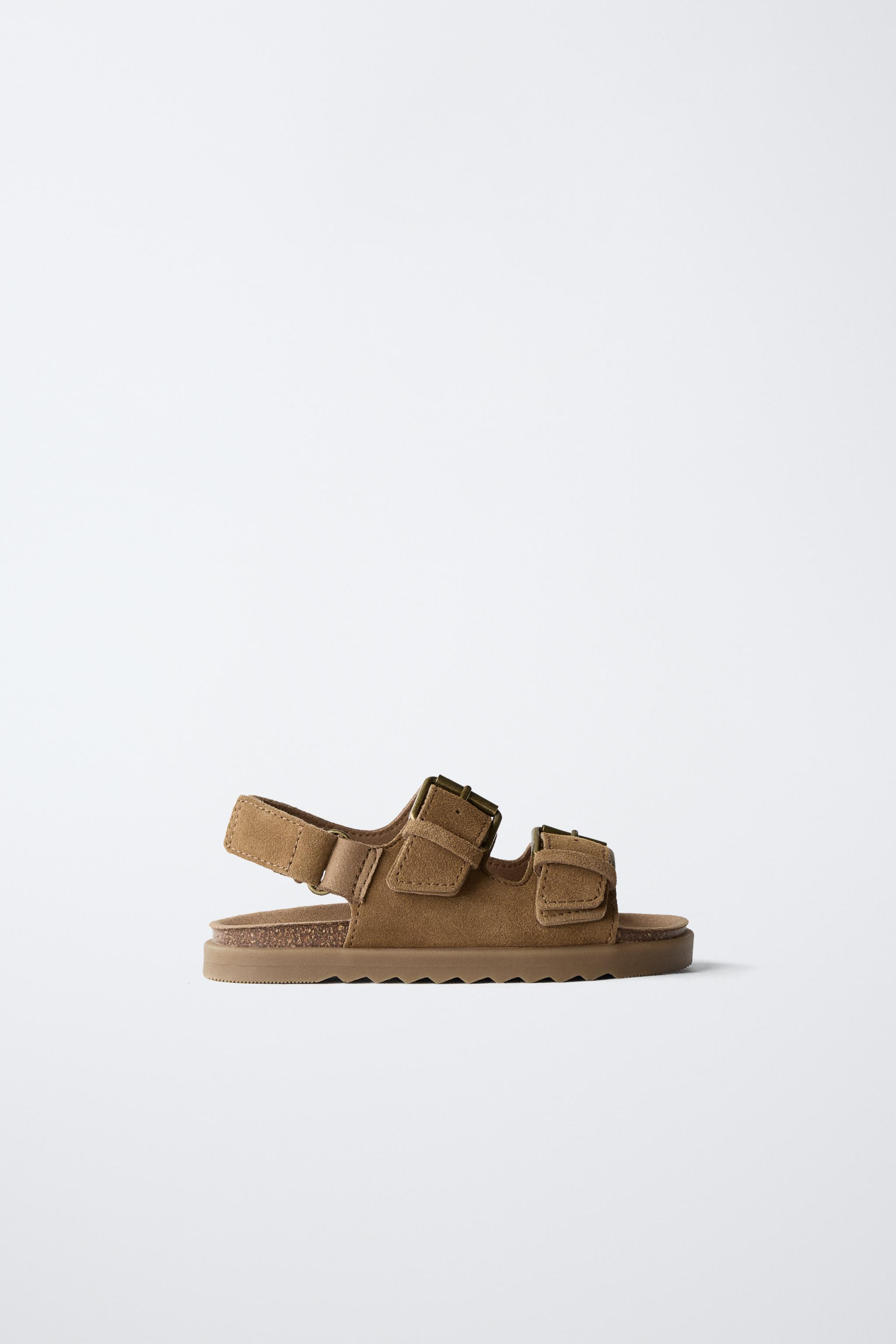 100% split leather cowhide sandals. Double buckle closure at the instep and hook-and-loop strap a... | Zara US