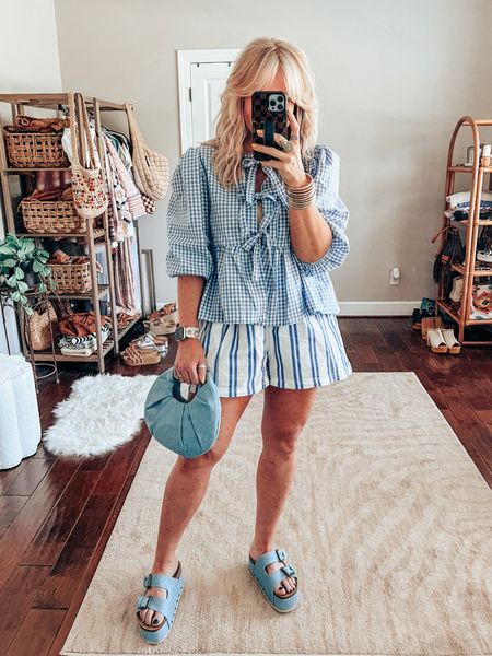 This gingham peplum top is adorable! It matches perfectly with my striped shorts! 
Top M
Shorts M
Sandals TTS 
✨Sparkl watchband save with code MANDIE 
 

#LTKStyleTip #LTKFindsUnder50 #LTKOver40