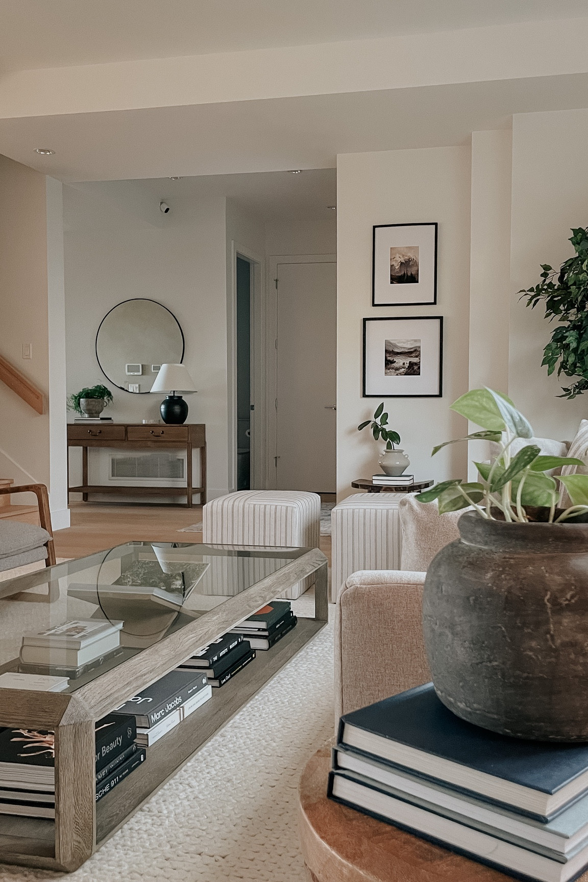 Living room and entryway. Entryway console table back in stock. Round mirror. Cube ottomans. Living room decor. Home decor. Front entry decor. Family room. Living room rug  

#LTKhome #LTKstyletip #LTKFind