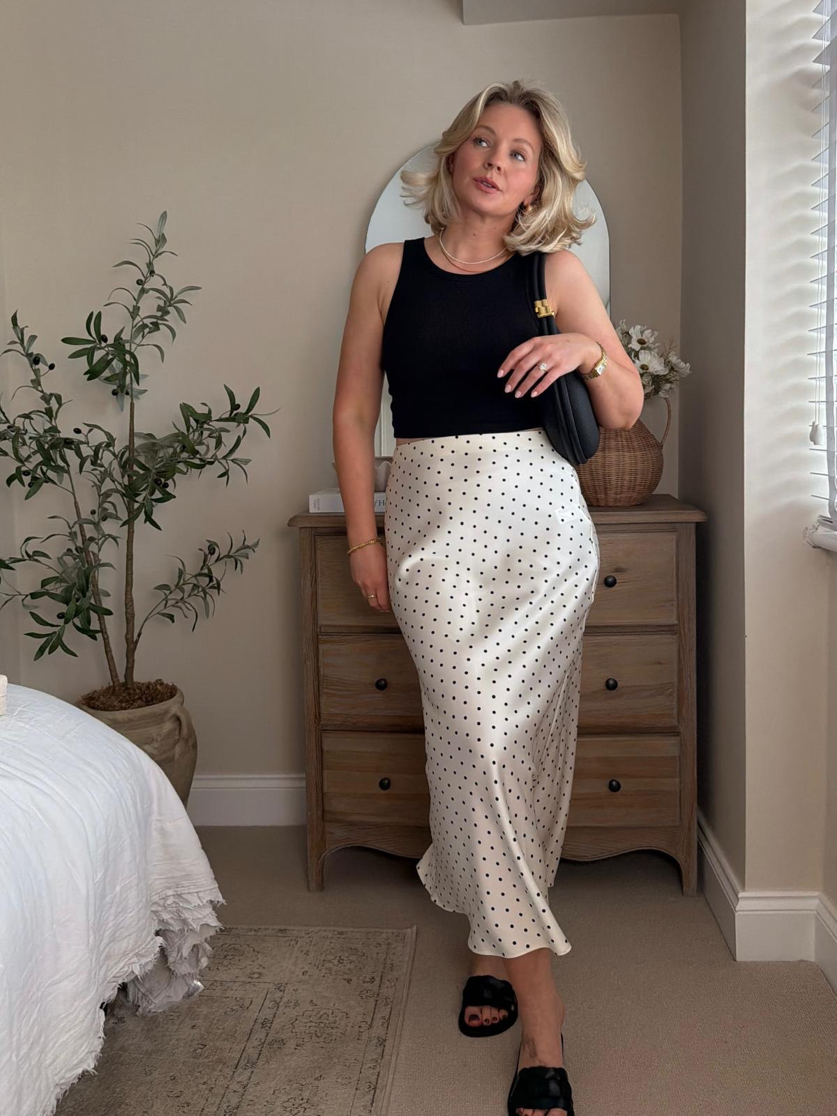 Midi Skirt Outfit Ideas! 

Black Tank Top, Polka Dot Satin Skirt, Monochrome Outfit, Black And White Summer Look, Polka Dot Midi Skirt, Minimal Chic Outfit, Casual Evening Outfit, Holiday Dinner Look, Elevated Basics, Effortless Summer Style, Neutral Capsule Wardrobe, Day To Night Outfit, Classic Polka Dot Styling.

#LTKspring #LTKuk #LTKsummer