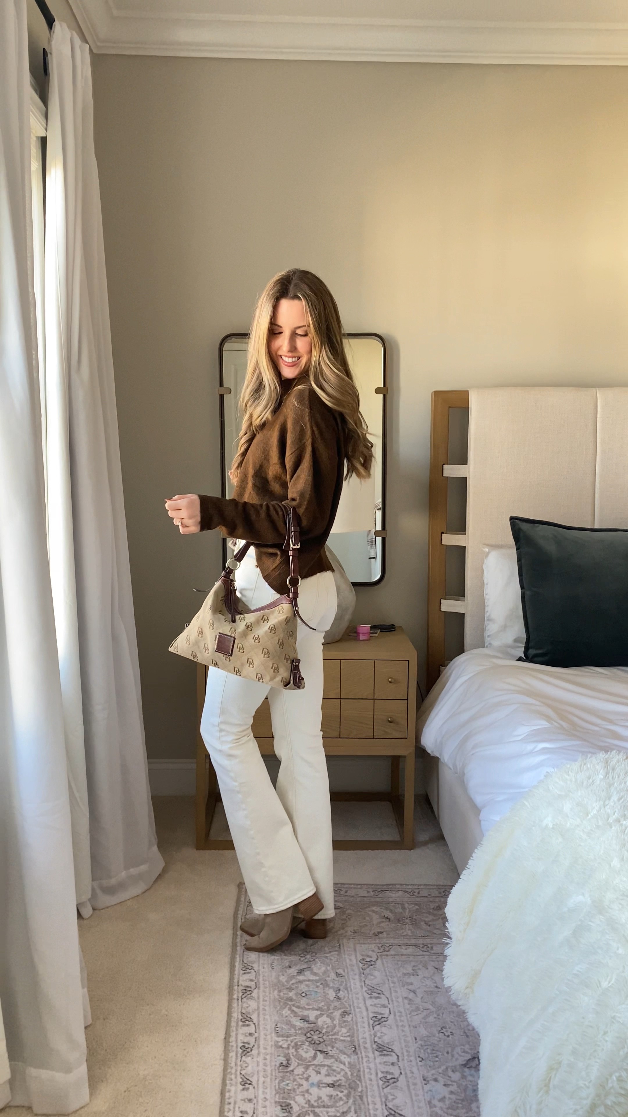 Brown sweater, white jeans, booties, monogram shoulder bag. Jeans are on sale for under $60

#LTKstyletip #LTKunder100 #LTKsalealert