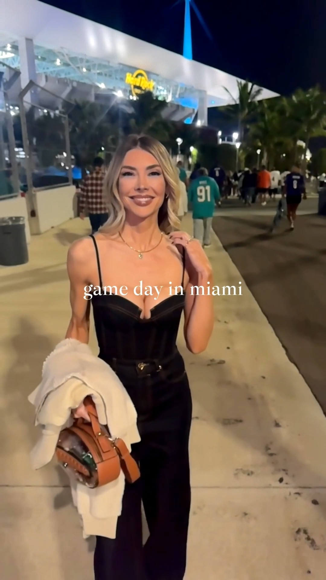 Thursday Night Football vlog! Miami edition ✨ The stars of the show are my diamonds from Happy Jewelers in OC. The pear shaped bezel necklace, and matching diamond earrings and tennis bracelet shone under the lights. Put these on your Christmas wish list NOW! My cropped denim bustier top and straight leg jean are both Zimmermann and currently 50% off so run! My snake booties are Alexandre Birman, and I linked some amazing similar options also on sale. My clear football purse is from Etsy. 

#LTKStyleTip #LTKSaleAlert #LTKShoeCrush