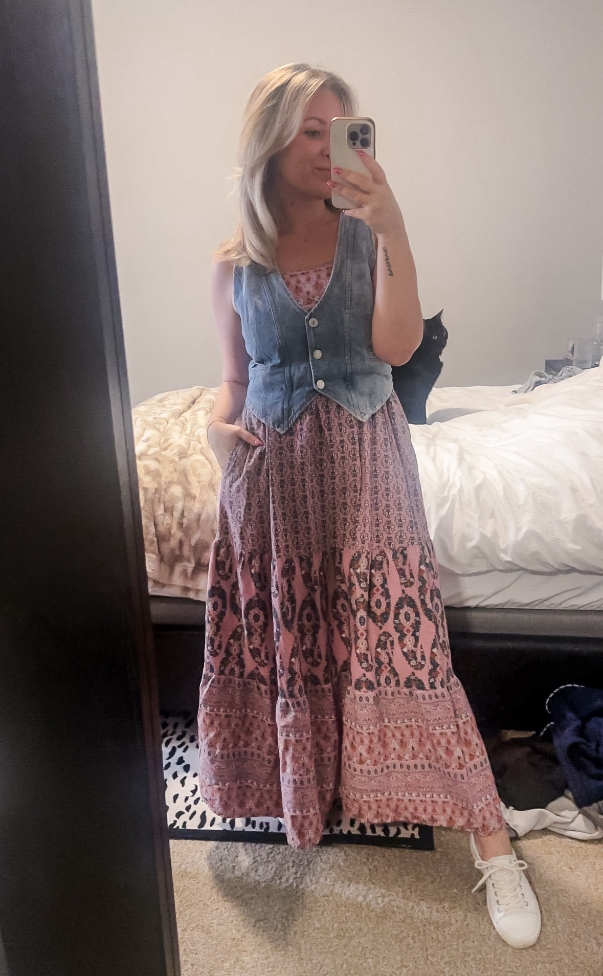 An effortless look that looks so chic! Pairing a denim vest over a loose base layer, such as a dress like shown here, a maxi skirt, or loose wide leg trousers. Try a longer denim vest with a split front for a modern twist, or to support your body type. As a pear shape myself, the vest being cropped helps play with proportions and makes me look more cinched! 

#LTKPetite #LTKStyleTip #LTKMidsize