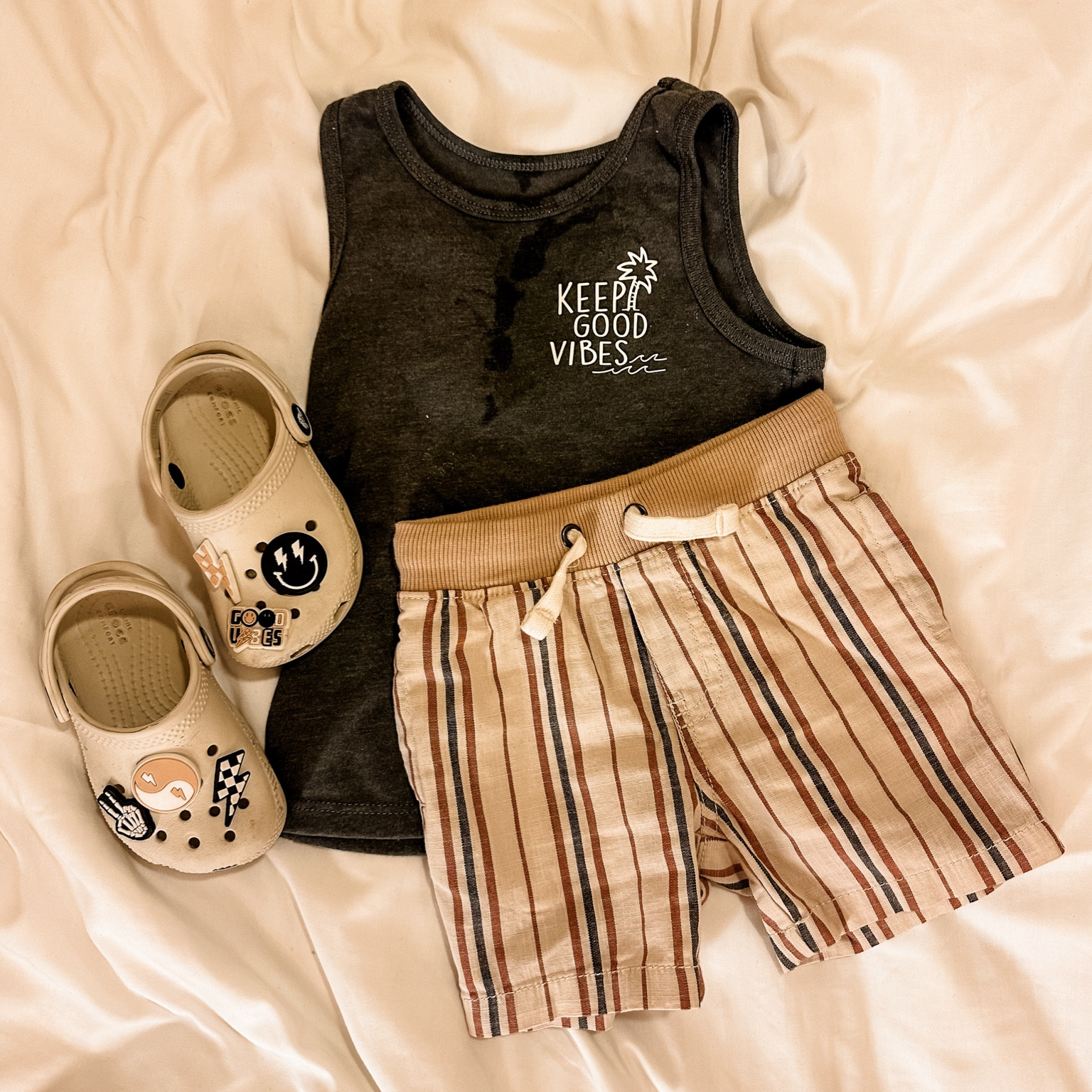 Toddler boy outfit for vacation! My little guy is 33” tall and 26 lbs wearing a 2T tank and 18M shorts 😍 comment if you need to find these amazing croc charms! #toddlerboystyle #toddlerboyoutfit #boyclothes #boyoutfit #vacationoutfit #beachoutfit #beachstyle #beachbaby 

#LTKbaby #LTKkids #LTKtravel