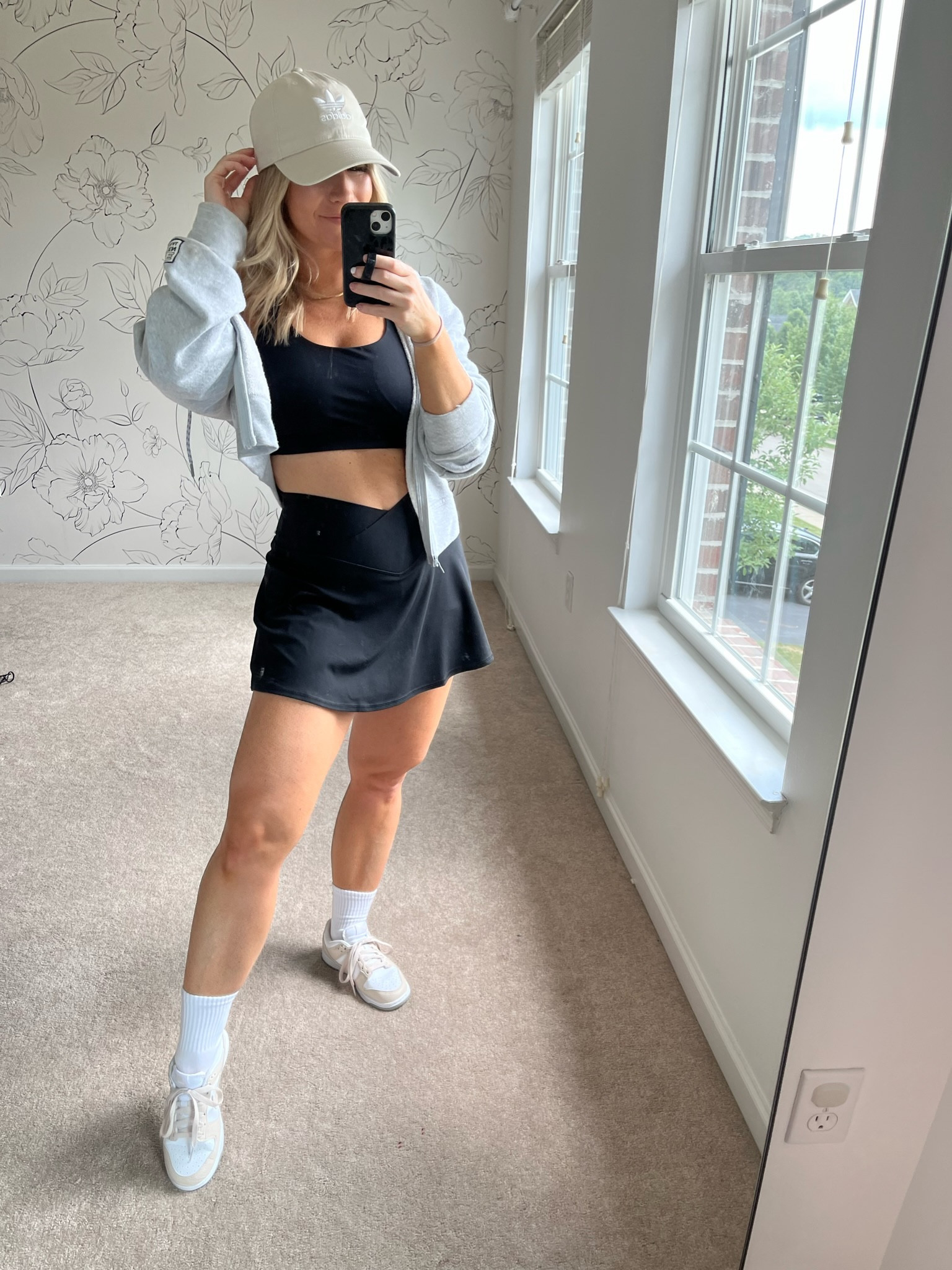 Aerie black tennis skirt, Lululemon energy bra, cropped hoodie, Adidas hat, and Nike sneakers 

#LTKsalealert #LTKSale #LTKfit