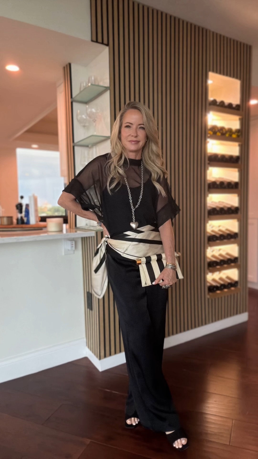 The outfit that proves black is never boring. 🖤

I elevated this classic look with a sheer top, a silk scarf tied at the waist, a statement necklace, and a striped clutch. These are the little styling details that make simple pieces feel fresh and modern.

Everything is timeless, versatile, and easy to mix with pieces you already own.

#LTKootd #LTKOver40 #LTKPetite