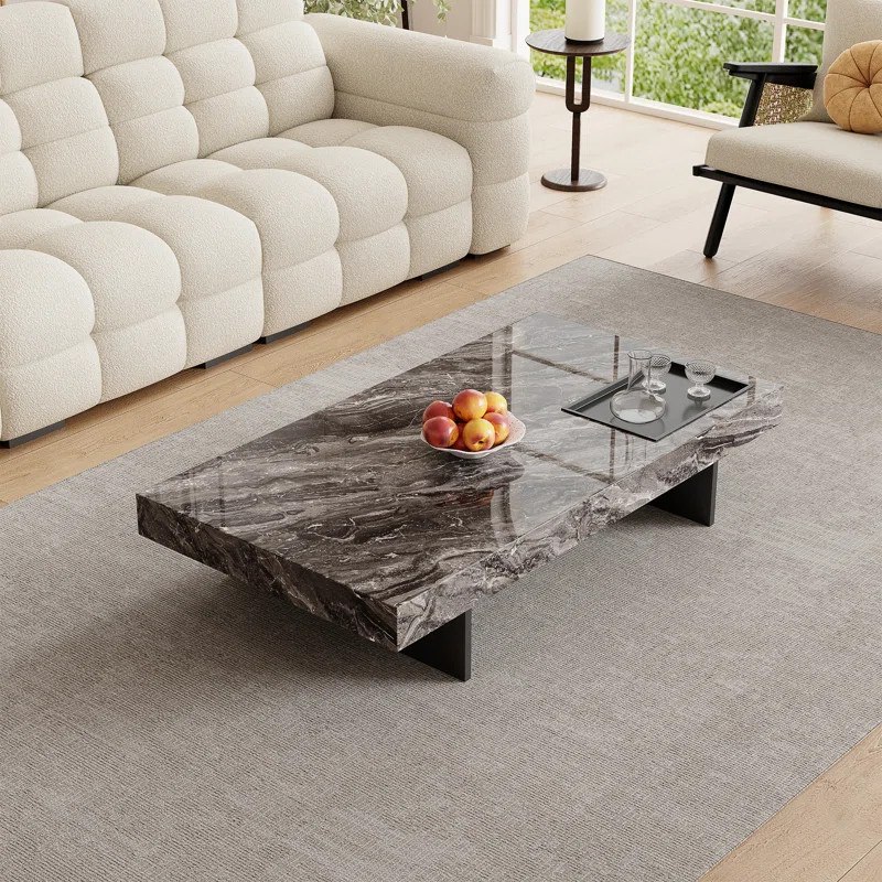 In the warm embrace of afternoon sunshine, this 51-inch modern coffee table gracefully stands at ... | Wayfair North America