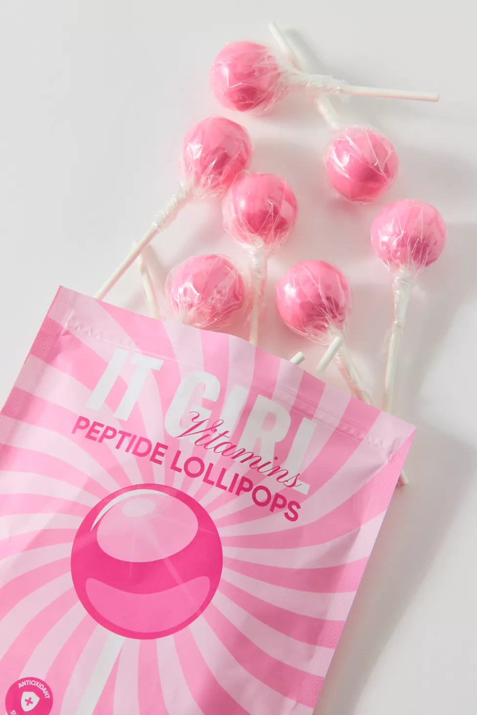It Girl Vitamins Lollipop Hard Candy Sucker Beauty Supplement | Urban Outfitters (US and RoW)