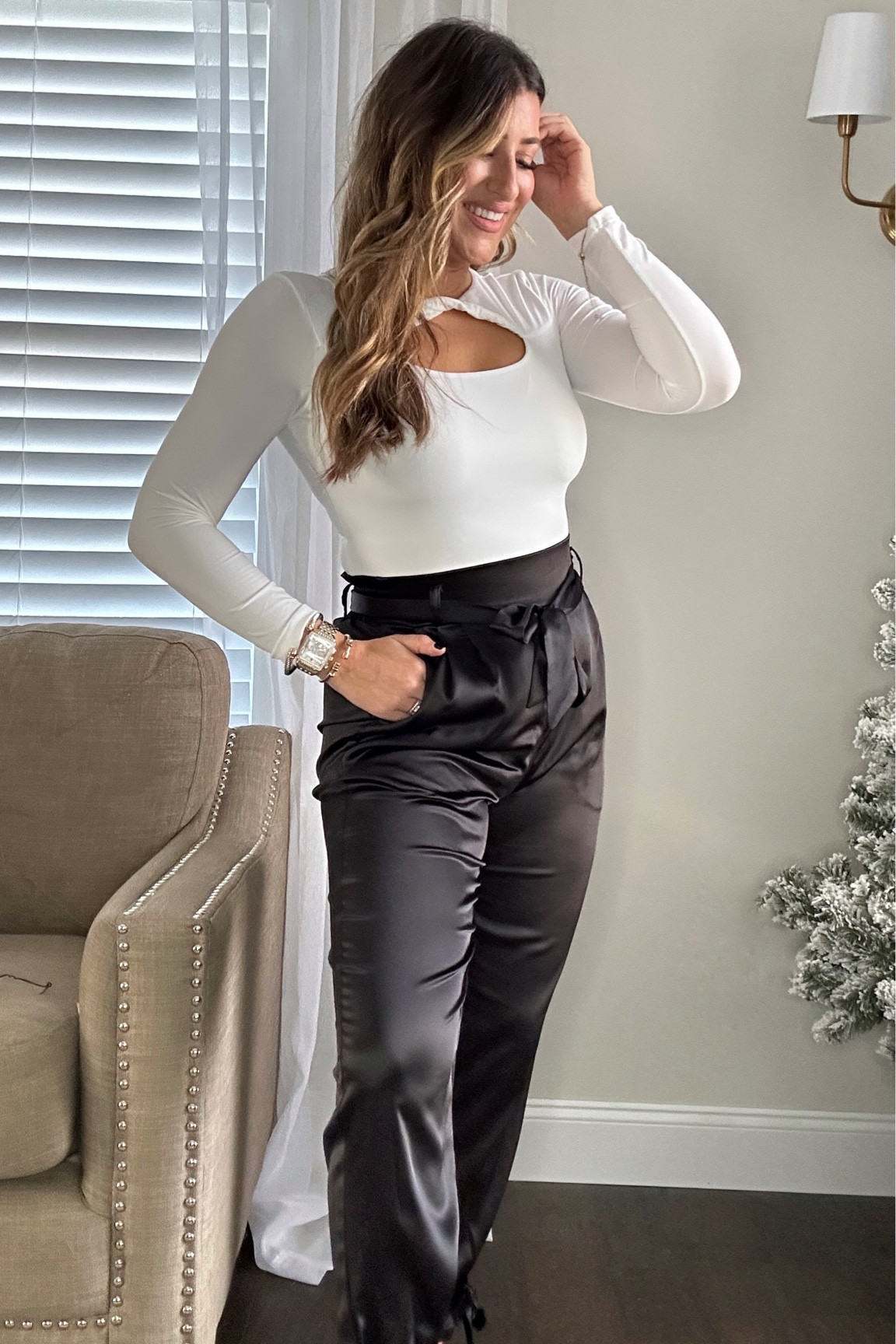 Another holiday party outfit this time with these satin pants and white bodysuit. How cute is this chest cutout?! Wearing meds. Two to ship and use code JOLLY on the heels! Follow for more xx

#LTKparties #LTKHoliday #LTKstyletip