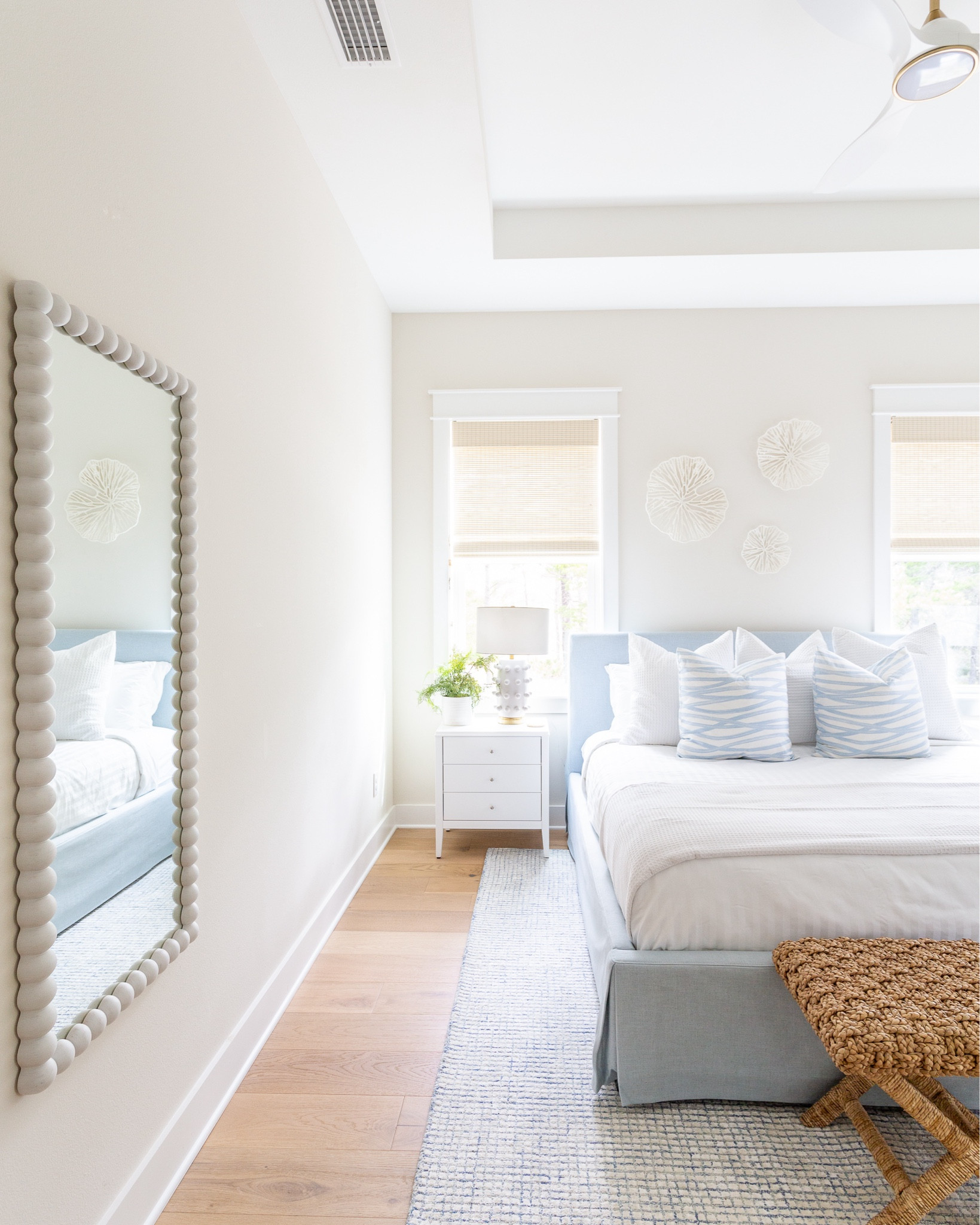 A view of the primary bedroom at Hola Beaches Casita, our newest 30A rental property! Includes a light blue upholstered bed, white nightstand, bubble dot lamp, wavy pillow covers, paper mache coral sculptures and a blue and white grid rug! See more of the home and this space here: https://lifeonvirginiastreet.com/hola-beaches-casita-30a-tour/.
.
#ltkhome #ltksalealert #ltkfindsunder100 #lrkfindsunder50 #ltkstyletip #ltkseasonal #ltktravel Walmart home, Amazon home, Target home

#LTKSaleAlert #LTKSeasonal #LTKHome
