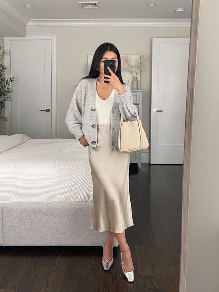 slip skirt outfits for spring work wear 

• Quince alpaca-wool cropped cardigan in xs 

• Quince 100% silk skirt in champagne xs - color is beautiful 

I wear with uniqlo shaper shorts 

• Adidas sambas men's 4 = women's 5/5.5

• J crew slingbacks 

• Songmont bag 

#petite spring outfits #LTKSpringSale

#LTKfindsunder100 #LTKstyletip #LTKSeasonal