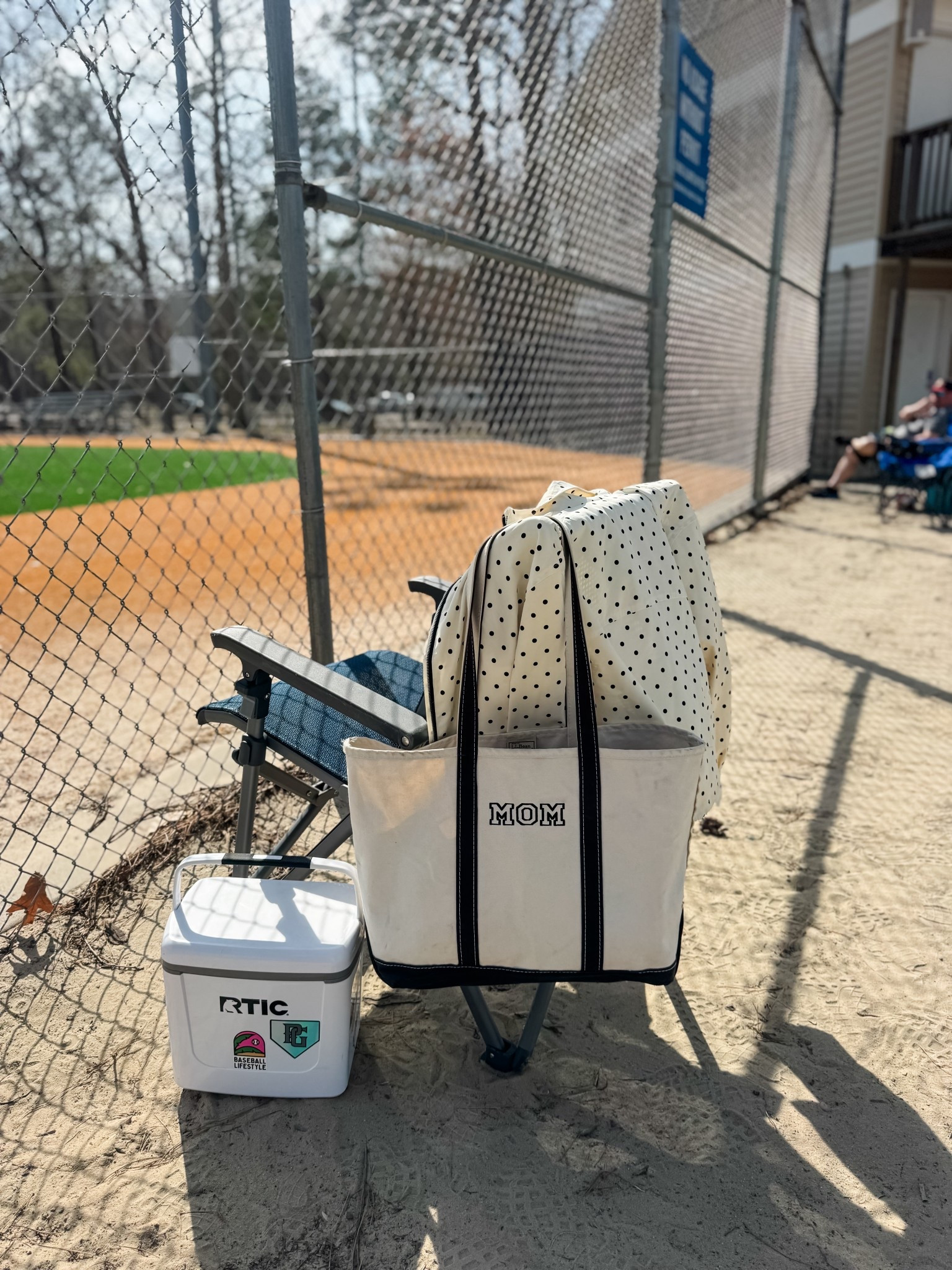Varsity Baseball Mom essentials 
-Yeti chair 
-Rtic cooler 
- Canvas tote
- polka dot jacket 

Baseball Mom essentials
Sports Mom  

#LTKKids #LTKdayinmylife #LTKActive