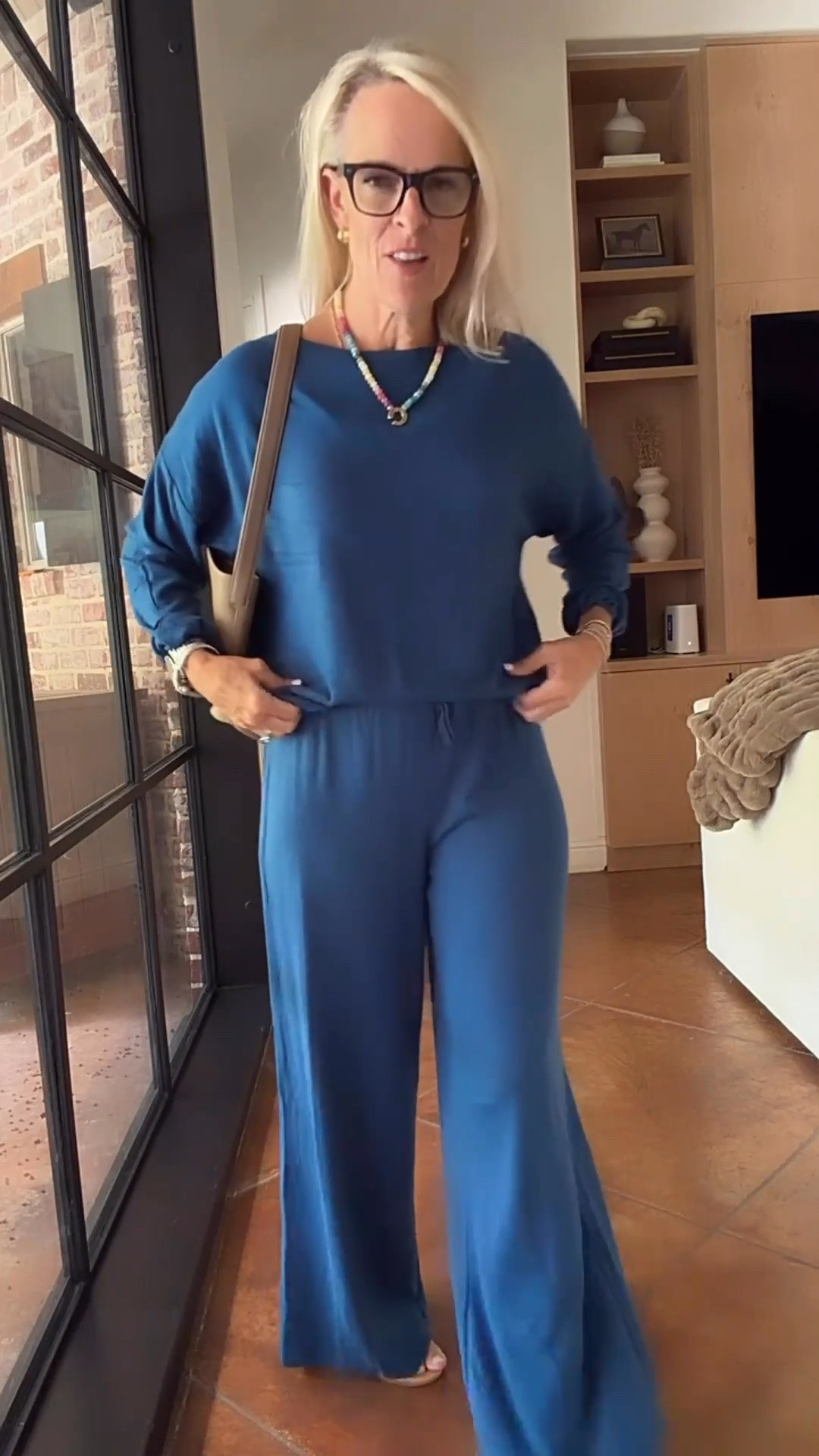 This lightweight lounge set is incredibly soft and comfortable, with an easy boat-neck top and wide-leg pants that make it feel a little more polished than typical loungewear. I’m in a small in both pieces, and I love that I can wear this at home, for travel, or out for a casual day.

💡 LTK MADE EASY
❤️ Heart = Support my posts!
🔖 Save = Get sale & restock alerts
📋 Lists = Keep favorites organized
📲 Share = Send lists and products to a friend. Hello, Christmas List!
💬 Comment = Ask me anything about what I’m wearing.:-)

#LTKootd #LTKgrwm #LTKOver40