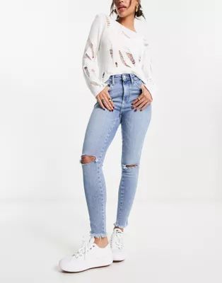 Free People skinny jeans with rip details in light blue | ASOS (Global)