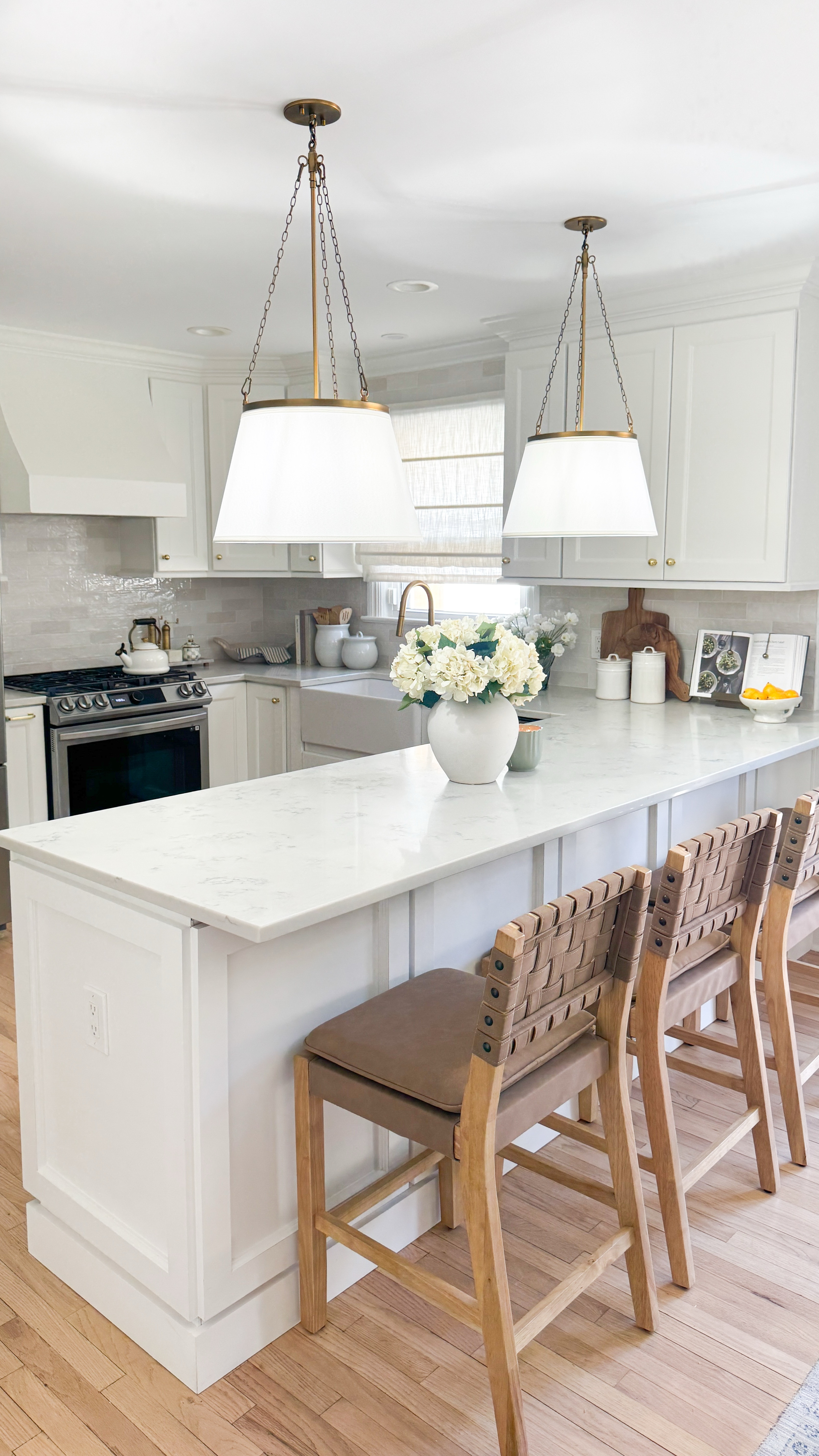 Our kitchen makeover is finally done and these gorgeous @lightopia pendants were the final piece that pulled it all together. The white linen empire shade wrapped in the most perfect soft gold finish—it’s the kind of detail that makes the whole space feel elevated and warm.

It’s wild how much lighting can transform a room!

Looking to upgrade your kitchen lighting too? Let this be your sign. Scroll down to shop! 🤎

#LTKStyleTip #LTKWatchNow #LTKHome
