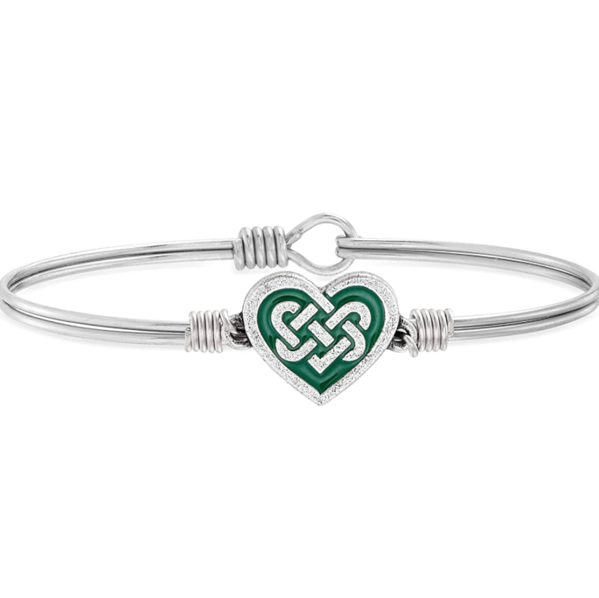 Luca + Danni Celtic Heart Bangle Bracelet.  This handmade Celtic love knot bracelet is an expression of the affection that weaves two hearts as one. A green enamel finish underlies this modern reworking of the classic Anam Cara Knot, lending lasting Irish blessings on St. Patrick’s Day and every day.

#lucaanddanni #irish #celtic #madeintheusa

#LTKU #LTKSeasonal #LTKFind