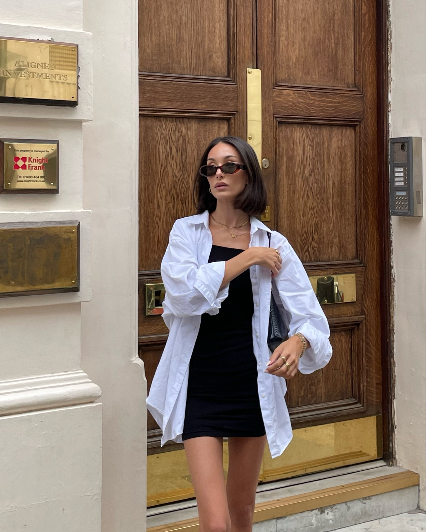 White oversized shirt, white shirt, black sleeveless dress, mini black dress, black baguette shoulder bag, black bag, oval sunglasses, sunglasses, spring outfit, summer outfit, holiday outfit, minimal style, cos, Boden, beach outfits, Karen Millen

#LTKeurope #LTKSeasonal #LTKstyletip