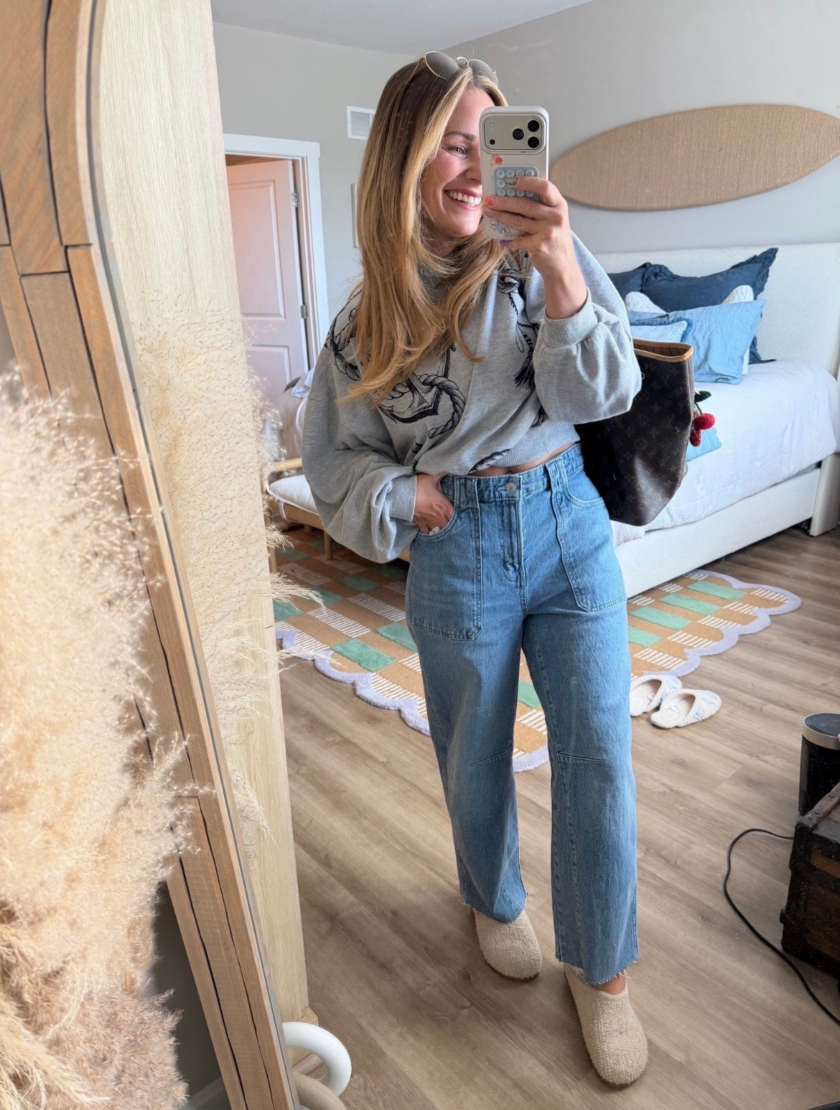 Your casual-cute era just found its uniform 🤍

The kind of outfit you throw on without thinking… but somehow still looks put together every single time. Slightly cropped sweatshirt + high-rise straight leg denim = that effortless, flattering combo we’re all chasing.

These jeans are so good—structured but comfy, hit at the perfect spot, and make your legs look longer (yes please). Paired with cozy slip-ons and my everyday tote and I’m out the door.

✨ 5’2 | size 4/6
✨ Wearing a small top | sized up in denim for a relaxed fit

Easy, wearable, on repeat 🔁
Everything linked for you ⬇️
