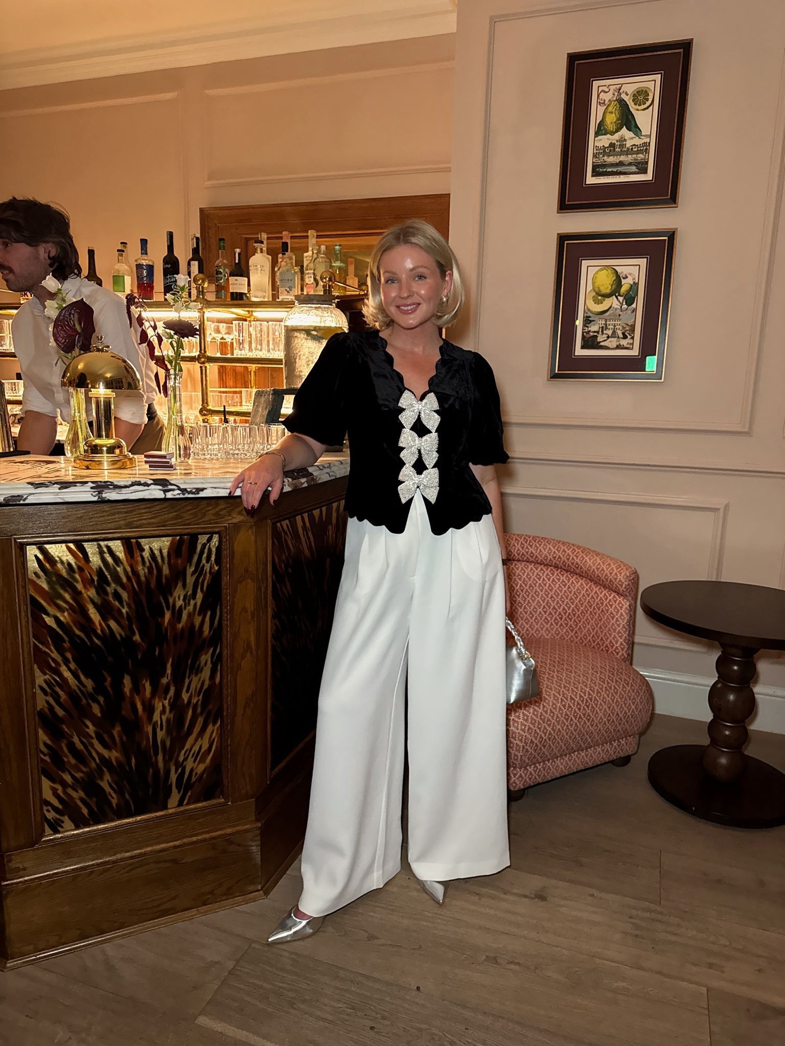 Size S in top and 10 short in trousers  Chic autumn winter evening outfit inspiration - mint velvet black velvet bow scallop hem top, white wide leg darted trousers, silver sling back leather heels, gold pearl stud earrings & Katie loxton silver Arden braided top handle bag

#LTKuk #LTKdatenight #LTKstyletip