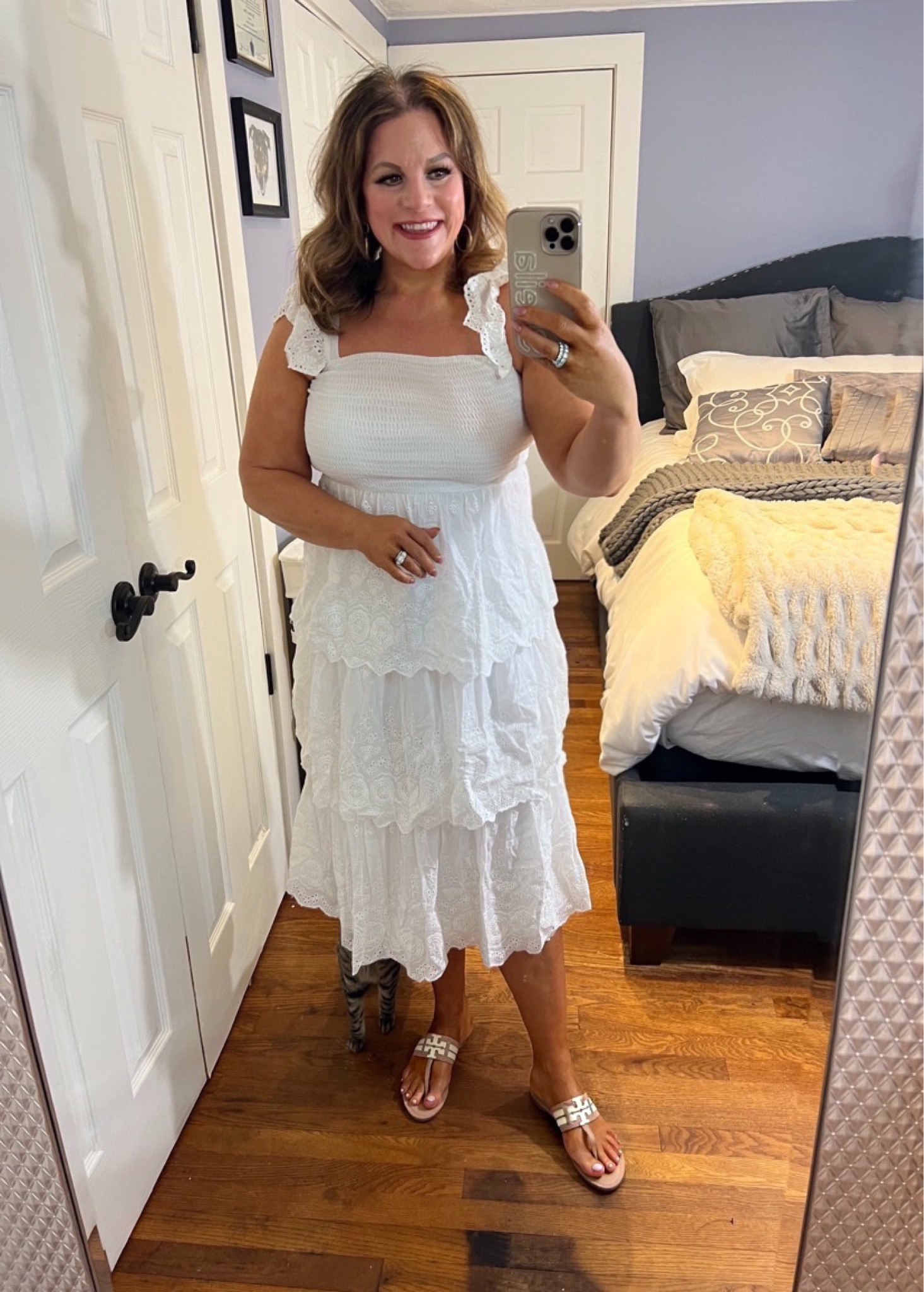 Another perfect summer dress that has me so excited for summer ‘23 to get here!
This one is will be so ideal for when it gets hot.
This White Smocked Tiered Midi Dress is 100% Woven cotton, with floral embroidery and pierced eyelet details throughout, shapes this cute dress that features a smocked bodice, a square neckline, and wide straps trimmed with ruffled details. The fitted waist tops a tiered skirt that boasts an A-line silhouette before falling to a midi hem. 
Fits TTS , I’m sure this one is going to sell out.
PS: can you find the hidden kitty? 🐈‍⬛
Spring dress, white dress, vacation outfit

#LTKSeasonal #LTKFestival #LTKunder100