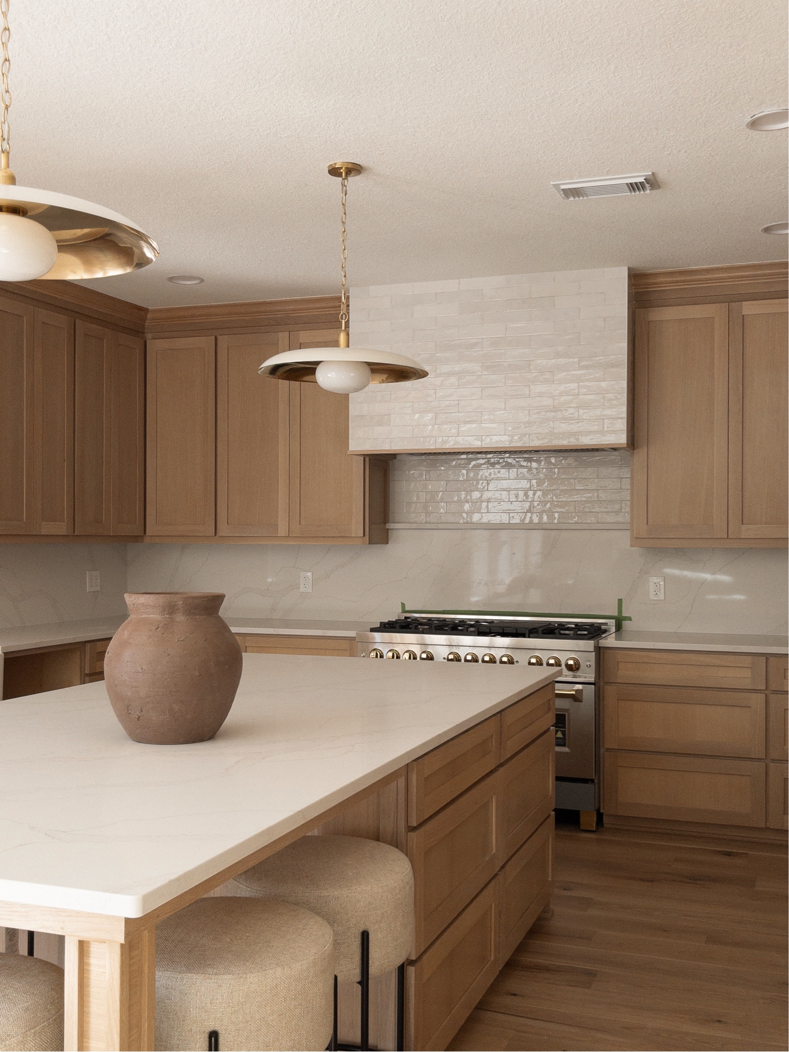 This view!! Almost done!! Waiting on hardware and gotta cut the slab behind the range! 

Kitchen, white oak cabinets, pendant lights, McGee and co, kitchen inspo, counter stools 

#LTKhome #LTKsalealert