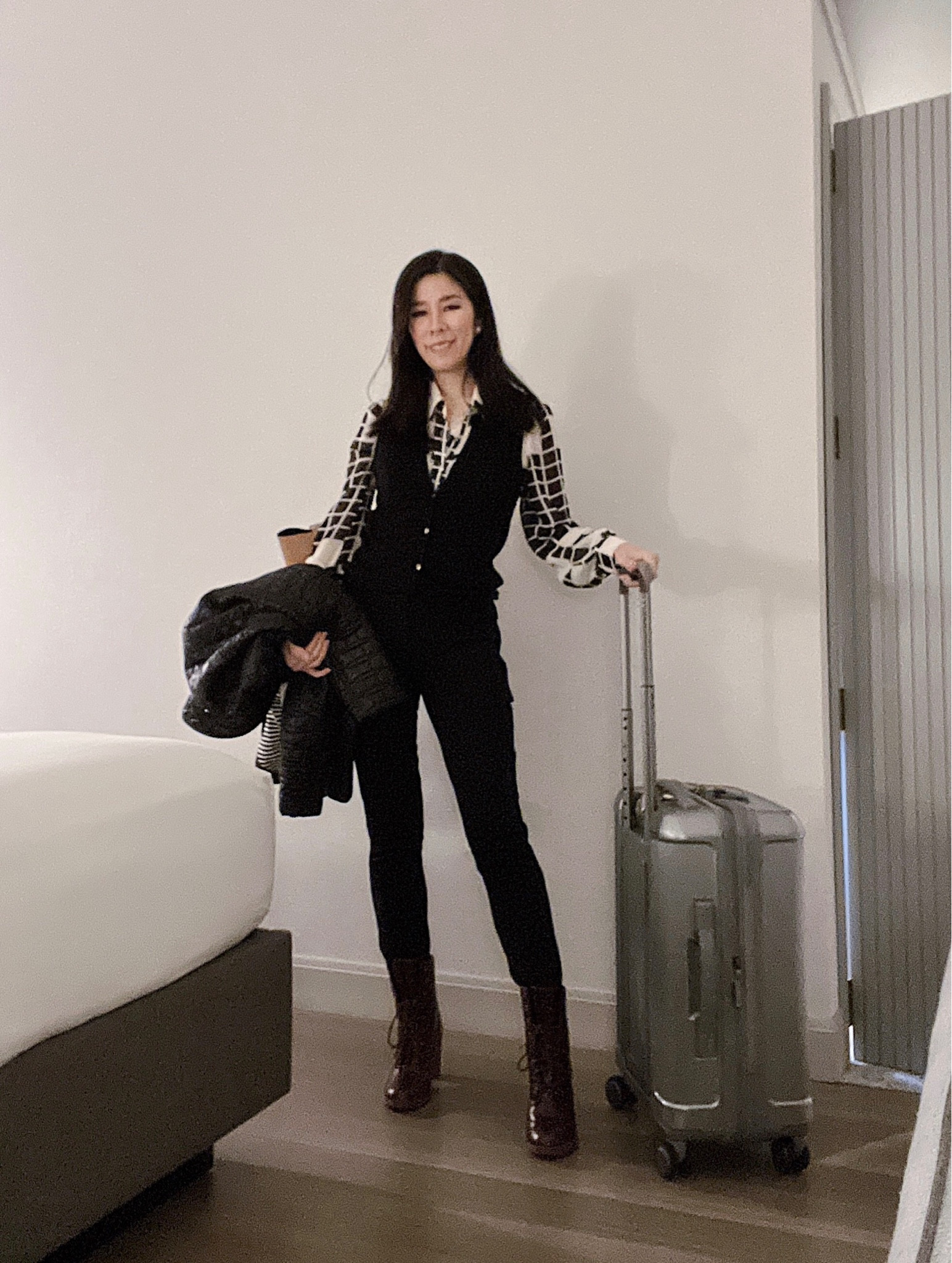 My favorite travel suitcase is this Samsonite carry-on! I love it so much that I have two - silver AND black! This was my airport look for a business trip to Palo Alto. I paired it with my ultra comfortable heeled Timberland boots, skinny black pants, a button-up sweater vest and a sheer black and white collar top. Also, I made the mistake of not bringing a puffer to Palo Alto during my previous trip so I made sure to have it with me this time! 

#LTKtravel #LTKitbag #LTKstyletip