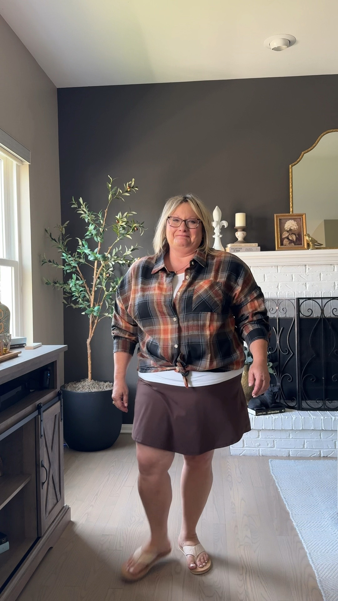 Perfect transition to fall outfit. Flannel shirt, brown skort and white cami come together for the layered outfit you need this fall. 

#fallfashion #plussizefashion

Brown skort, fall fashion, fall outfit, flannel shirts for women, plus size, plus size fashion, over  40 fashion, fall transition outfit

#LTKPlusSize #LTKOver40