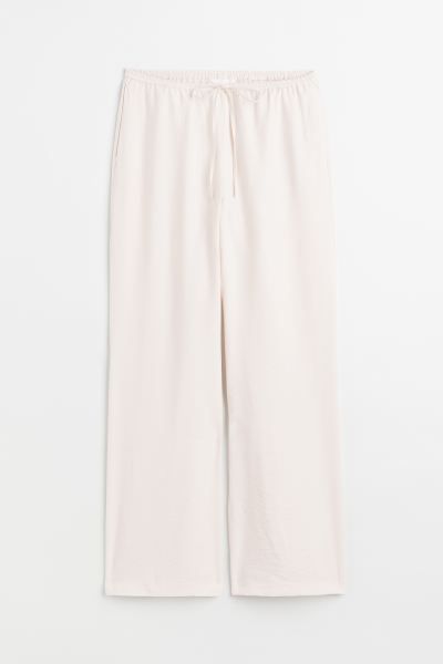 Trousers in satin with a regular waist that has covered elastication and a drawstring, discreet p... | H&M (UK, MY, IN, SG, PH, TW, HK)