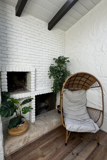 Love this corner in the home!!! It’s so cozy and the chair is so comfy & cute!!! It pairs so well with the greenery and white brick walls!! #outdoorfurniture #chair #patiofurniture #home #homedecor 

#LTKhome #LTKfamily #LTKfindsunder100