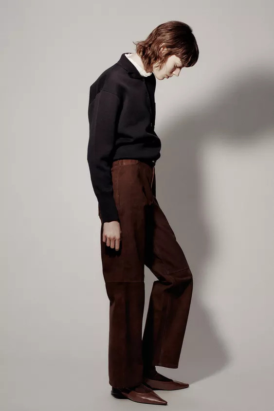 Pants made of 100% leather. Mid-rise with belt loops and five pockets. Front zip and metal button... | Zara US