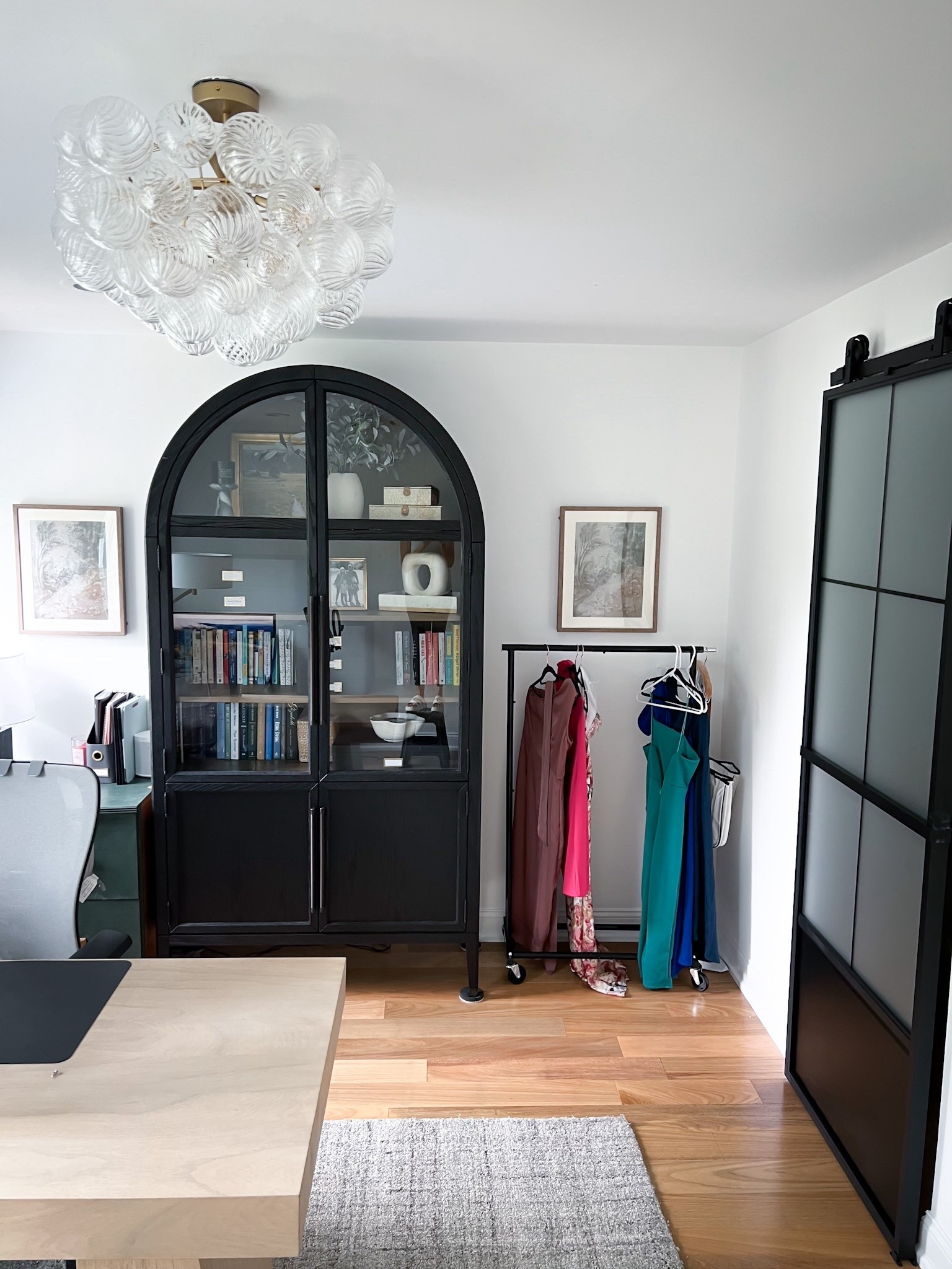 This layout keeps the space open and practical The CB2 desk gives me lots of room to work, and the Amazon barn door adds privacy while looking sleek. Vertical storage with the Arhaus cabinet helps keep gear and props organized without taking up floor space.

#LTKOver40 #LTKHome #LTKStyleTip