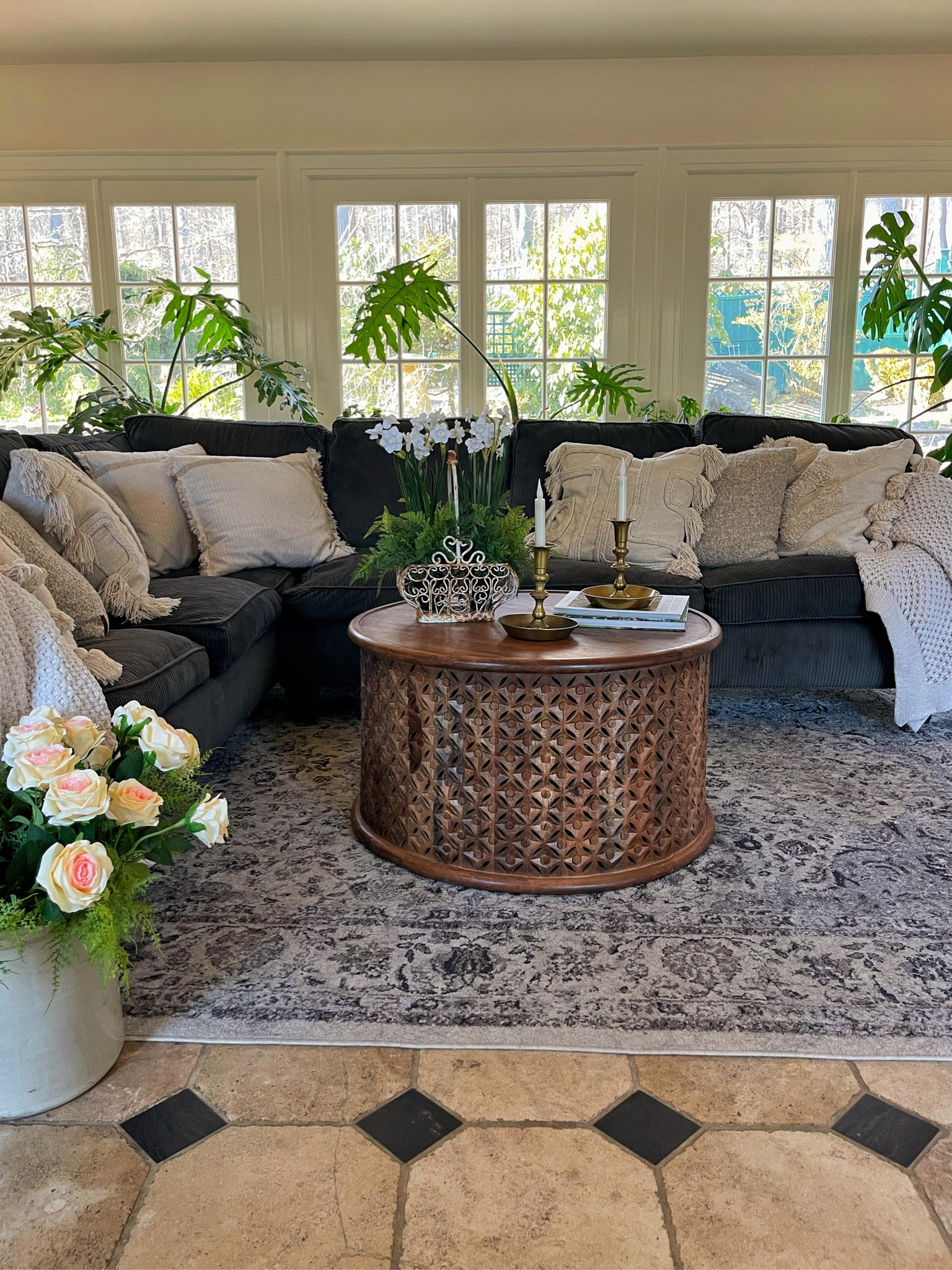 Cozy family room decorated for spring. 

Sectional sofa, area rug, pillow covers, mango wood coffee table, round coffee table, faux flowers, houseplants, indoor plants

#LTKhome #LTKsalealert #LTKSeasonal