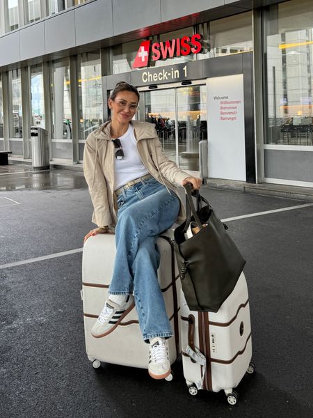 Just landed in Zürich! Airport outfit: same jeans from yesterday. Comfiest sized up. White tank and Moncler parka 
Warbu Parker glasses, Loewe Flamenco XL tote, great for travels, fits a lot! Delaney luggage and adidas spezial 

#LTKItBag #LTKShoeCrush #LTKStyleTip