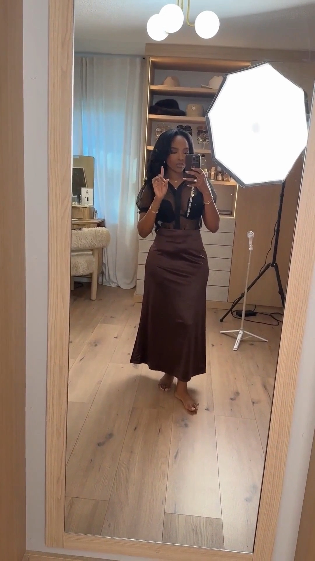 Scroll to shop this elevated date night look 🤎  

This satin skirt + sheer top combo is going viral right now—so flattering and gives that effortless luxe vibe. Chocolate tones are a top seller this season and pieces like this always have a high sell-out risk once they start trending. Such an easy way to look put-together, and you can style both pieces multiple ways so the cost per wear drops fast.

Perfect for date nights, dinners, events, and nights out.

📏 Measurements: 5’4”, 140 lbs, 34D bust, 27” waist, 40” hips  

Follow me on Instagram and YouTube @kirasfashionfinds  