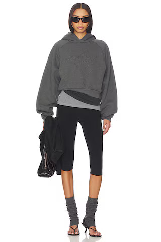 Fear of God ESSENTIALS 90's Raglan Hoodie in Charcoal Heather from Revolve.com | Revolve Clothing (Global)