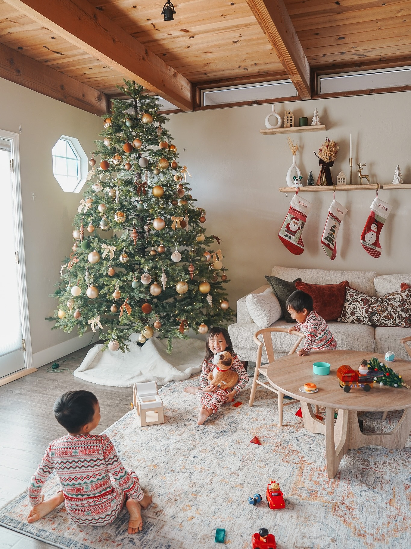 The coziest weekend afternoon enjoying our Christmas decor and soaking it all in 🎄✨

I don’t like how much bigger my kids look now compared to the last photos I took of them by our Christmas tree 😭😭 Time is such a thief and I feel like this holiday season is going by WAYYY faster than before! Maybe cause Elliette and Evan are both are the same school and there’s way more events for them there 😂❤️ I’m way behind on all things holiday but I put up all of our Christmas decor over the weekend and love how cozy and magical our playroom looks now 😍 Loved capturing these sweet moments of play with my 3 kids 🥹

Our holiday decor wouldn’t be complete without our @kingofchristmas tree! We went for it and tried a new style: this is the 9’ Rushmore Fir Artificial Christmas Tree 1000 Warm White LED Lights! It is so much bigger than our previous tree and I absolutely love how it makes such a huge statement in the room! ❤️ 

Their amazing trees are on sale now on @amazon for up to 40% off! 

@kingofchristmas #kingofchristmas #AD #gifted