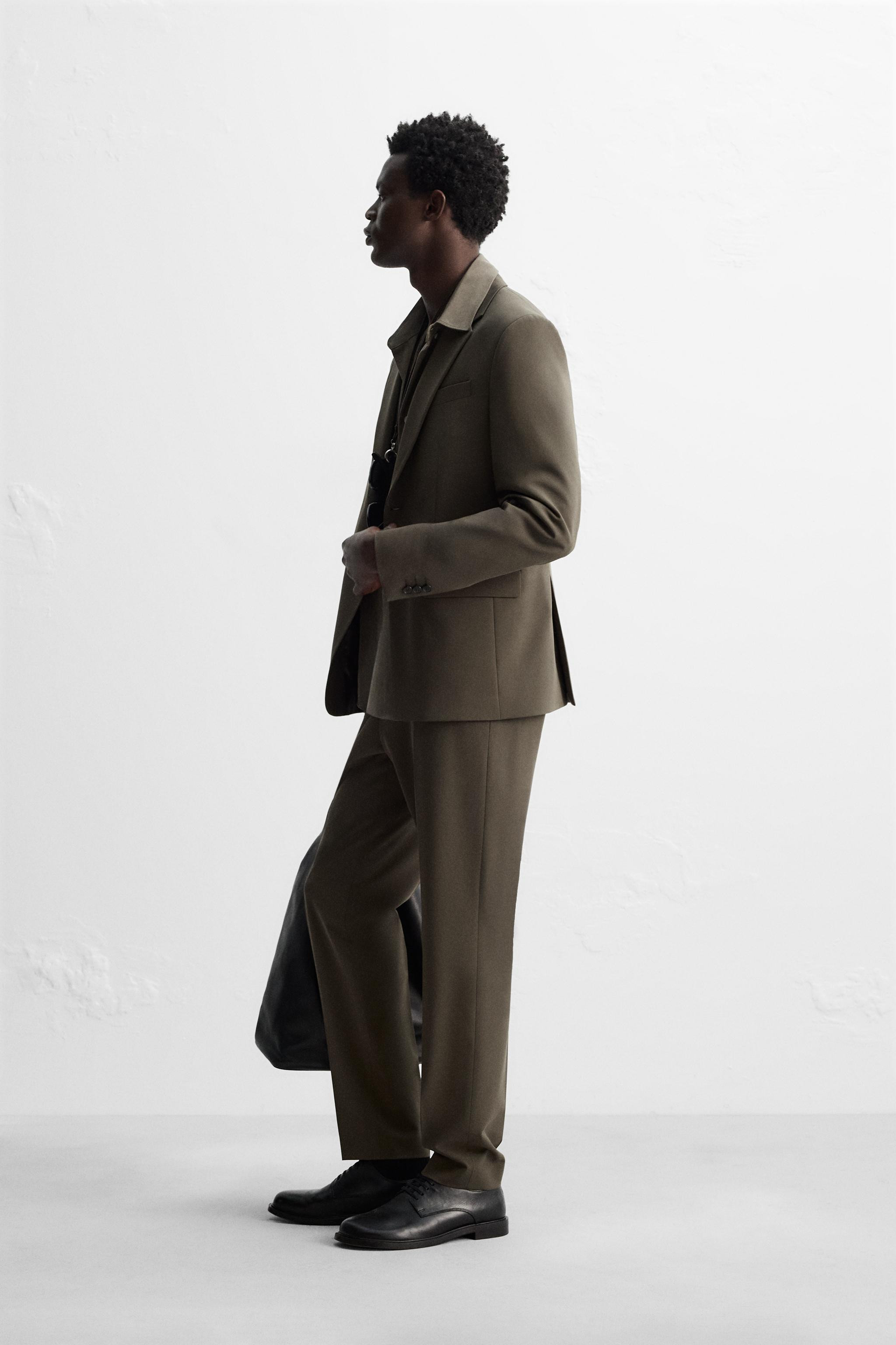 Slim fit blazer made of viscose fabric. Notched lapel collar. Long sleeves with buttoned cuffs. W... | Zara US