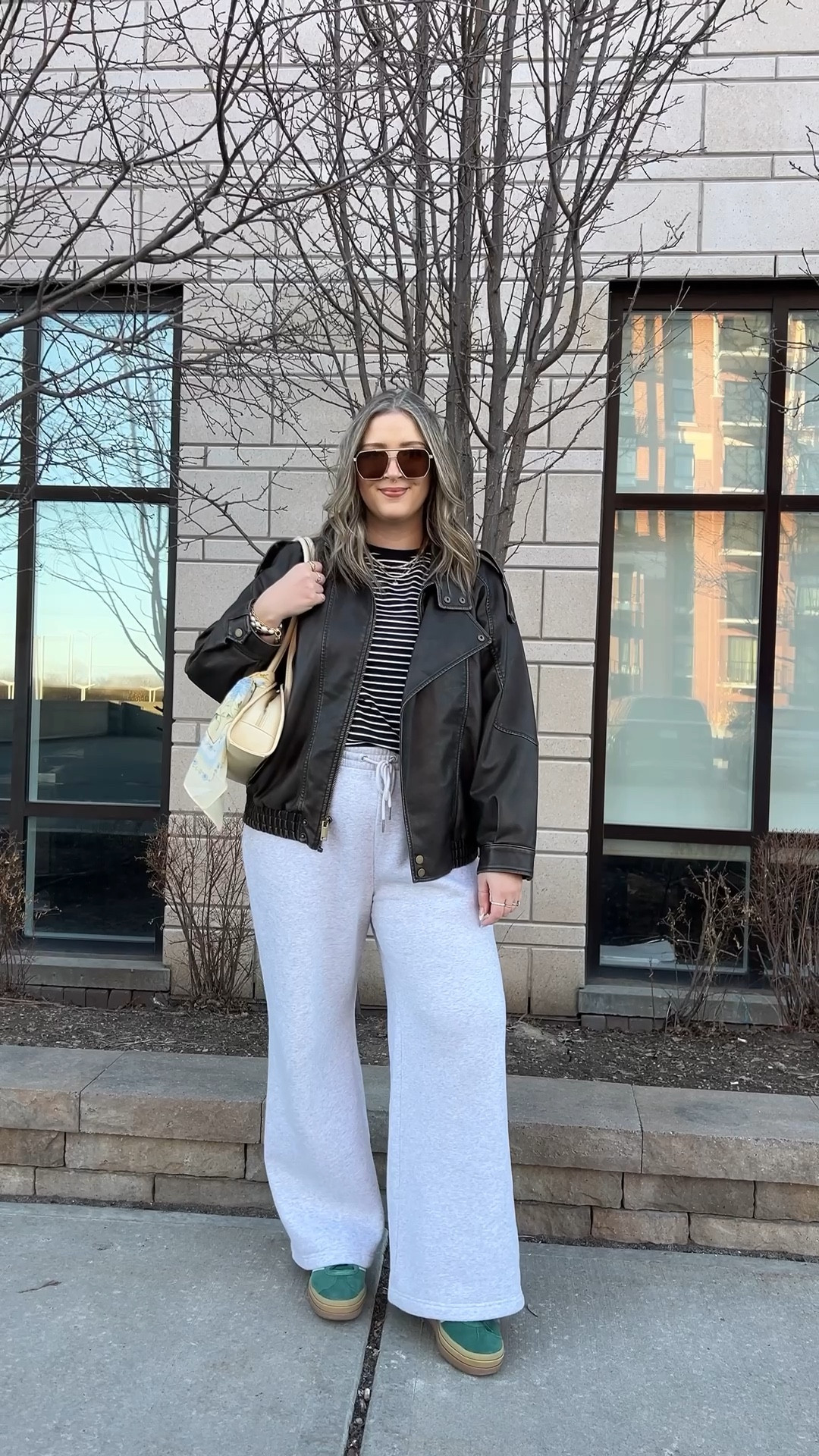 Yesterday’s spring outfit! Wearing my usual size L in the wide leg sweatpants (I love the thick material of these!) and L in the leather jacket. Sized up to XL in the tee cause I have a larger chest. Bag and scarf are Old Navy, Canadian links under “similar products”. Adidas gazelle sneakers run a little big, I’m a 9.5-10 and wear a 9.

#LTKmidsize #LTKstyletip