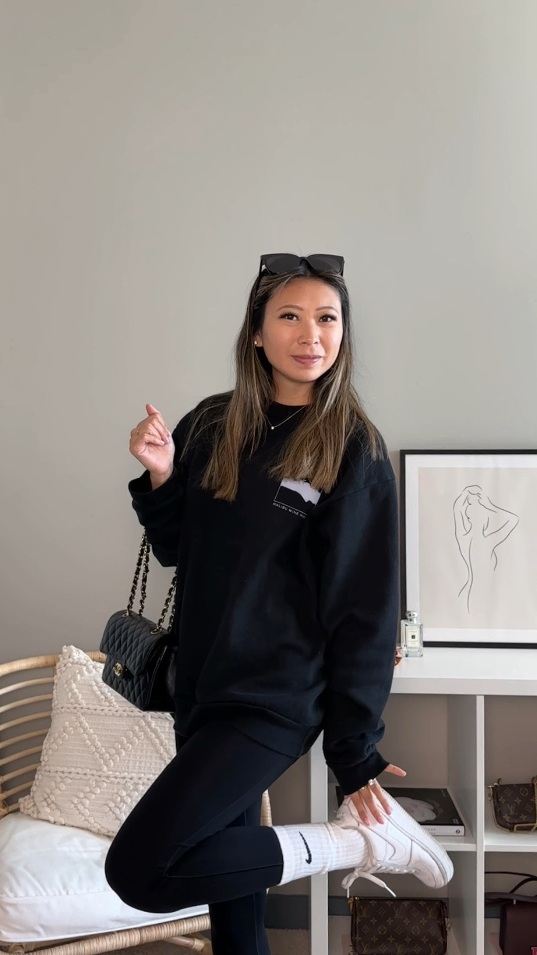 All black minimalist athleisure off duty model inspired outfit // outfit details - sweatshirt from malibu wine hikes (alternative linked), tee from aritzia, leggings from aerie, socks from nike, sneakers from nike, bag from chanel, sunglasses from gentle monster //  street style, outfit inspo, simple fits, parisian chic, fall outfit, fall fashion

#LTKfit #LTKSeasonal #LTKstyletip