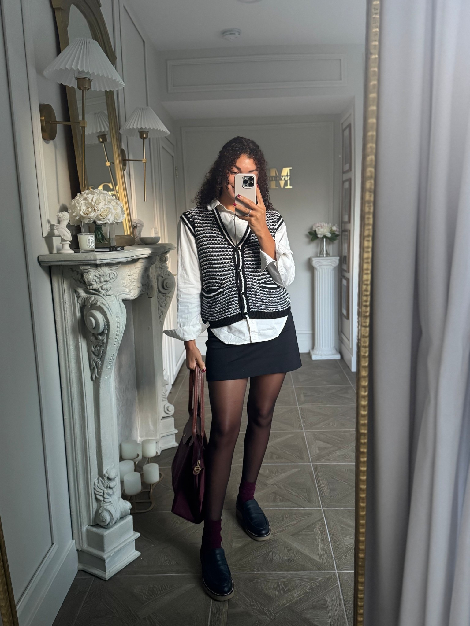 Preppy fall outfit: white button up, sweater vest, mini skirt, sheer tights, burgundy socks, loafers, and a Longchamp bag 

#LTKSeasonal #LTKStyleTip