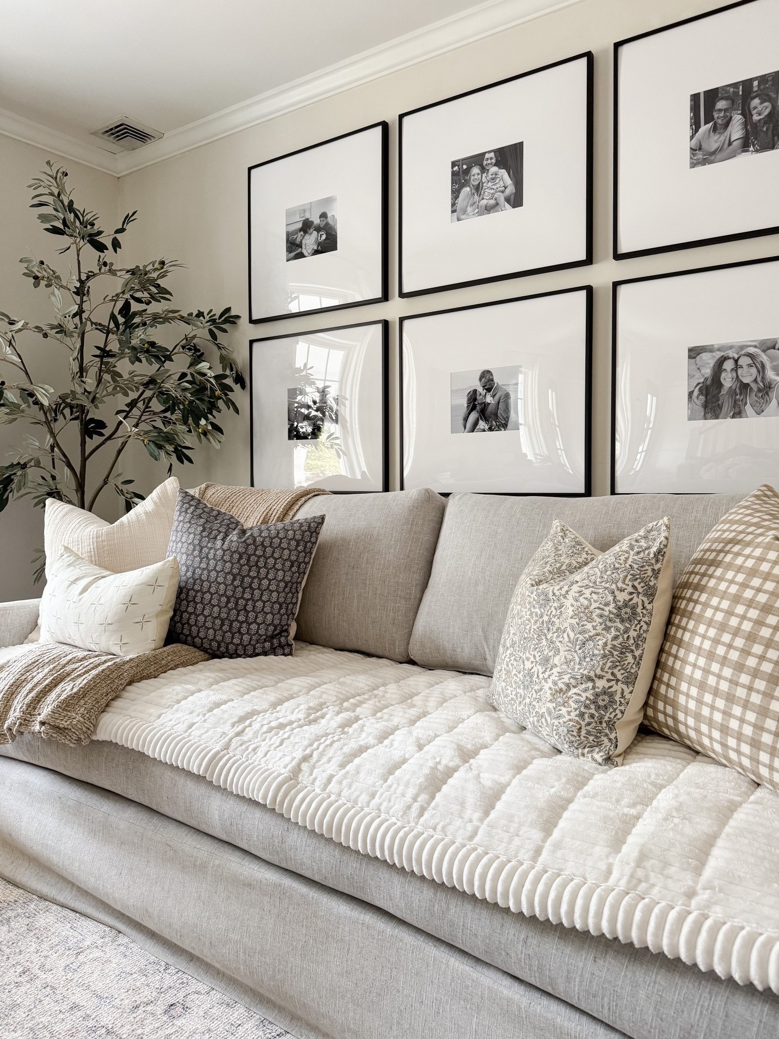 Living room decor ideas 🤍 Loving these finds for year-round display! Timeless, classic, and at various price points! Sofa cover, gallery frames, throw pillows, faux olive tree

#LTKHome #LTKSaleAlert
