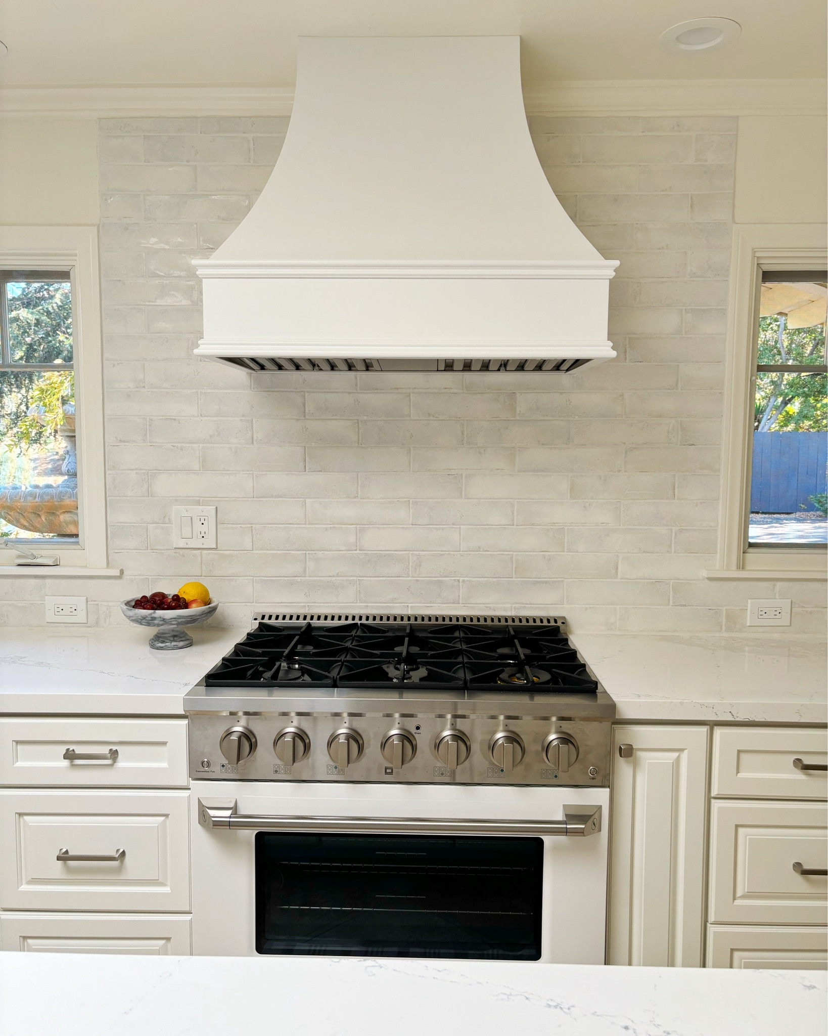 This range is on sale at Home Depot right now.  It looks high end but it’s much less than the designer ranges.  If you can, I always suggest making a statement with your range and hood.  I consulted with this client on this kitchen and helped them make some design decisions that pulled it together.  

#LTKHome #LTKStyleTip