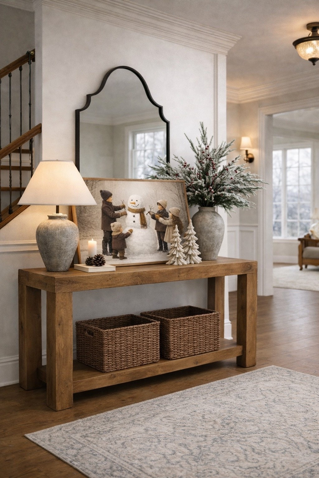 Warm Neutral Entryway Console Table with Woven Storage Baskets

Follow @farmtotablecreations on Instagram for daily home inspiration, styling ideas, and the best home finds.

A warm and welcoming entryway starts with a well-proportioned console table and thoughtful styling. This wood console brings in natural texture and a clean, timeless silhouette, while the woven baskets underneath add practical storage without sacrificing style. Layered decor on top keeps the look cozy and intentional, with soft lighting, winter greenery, and nostalgic artwork leaned casually for a collected, lived-in feel.

This setup is easy to adapt for any season—swap stems, artwork, or accessories while keeping the foundation pieces the same for a timeless look that works year-round.

#consoletable #entrywaytable #entrywaydecor #wovenbaskets #storagebaskets #neutralhome #homeinspo #homedecor #livingroomfurniture

#LTKHome #LTKSaleAlert #LTKFindsUnder50