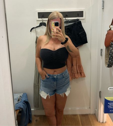 Summer clothes shopping is always fun, tried on all the different styles and lengths for Jean shorts, cargo skirt, dresses and this cute crochet knit tube top. Here I have on a Large and could have sized down it’s super stretchy for reference I’m a 34/36 G shorts are the curve shorter length in a size 8 in shorts I always size up cause I don’t feel comfortable when they fit too tight. Didn’t get the top cause being 46 didn’t feel it was something I would wear a ton but did get the shorts in a couple tones of blue and a black pair. I also got a cute maxi in sage green and some other items I will share soon. #jeans #denim #americaneagle #shorts #croptop #tubetop #crochettop #summerstyle #summerclothes #shortsforsummer 

#LTKFestival #LTKstyletip #LTKover40