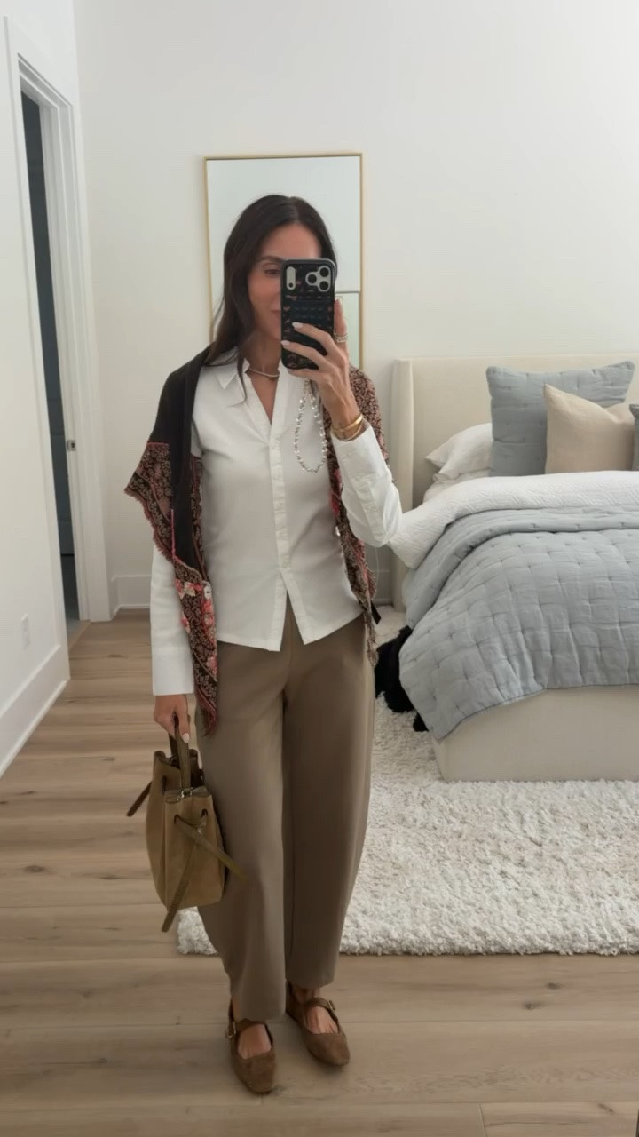 This is such a good way to layer for fall. The crisp white button down keeps the outfit classic, while the printed shawl adds color and texture without overwhelming the neutral pants. I love this with the suede Mary Janes and structured bag.

white button down, printed shawl, neutral pants, suede Mary Jane shoes, fall layering, fall outfit, classic fall style, neutral fall outfit, women’s fall fashion, casual chic outfit, annabrstyle

#LTKootd #LTKSeasonal #LTKOver40