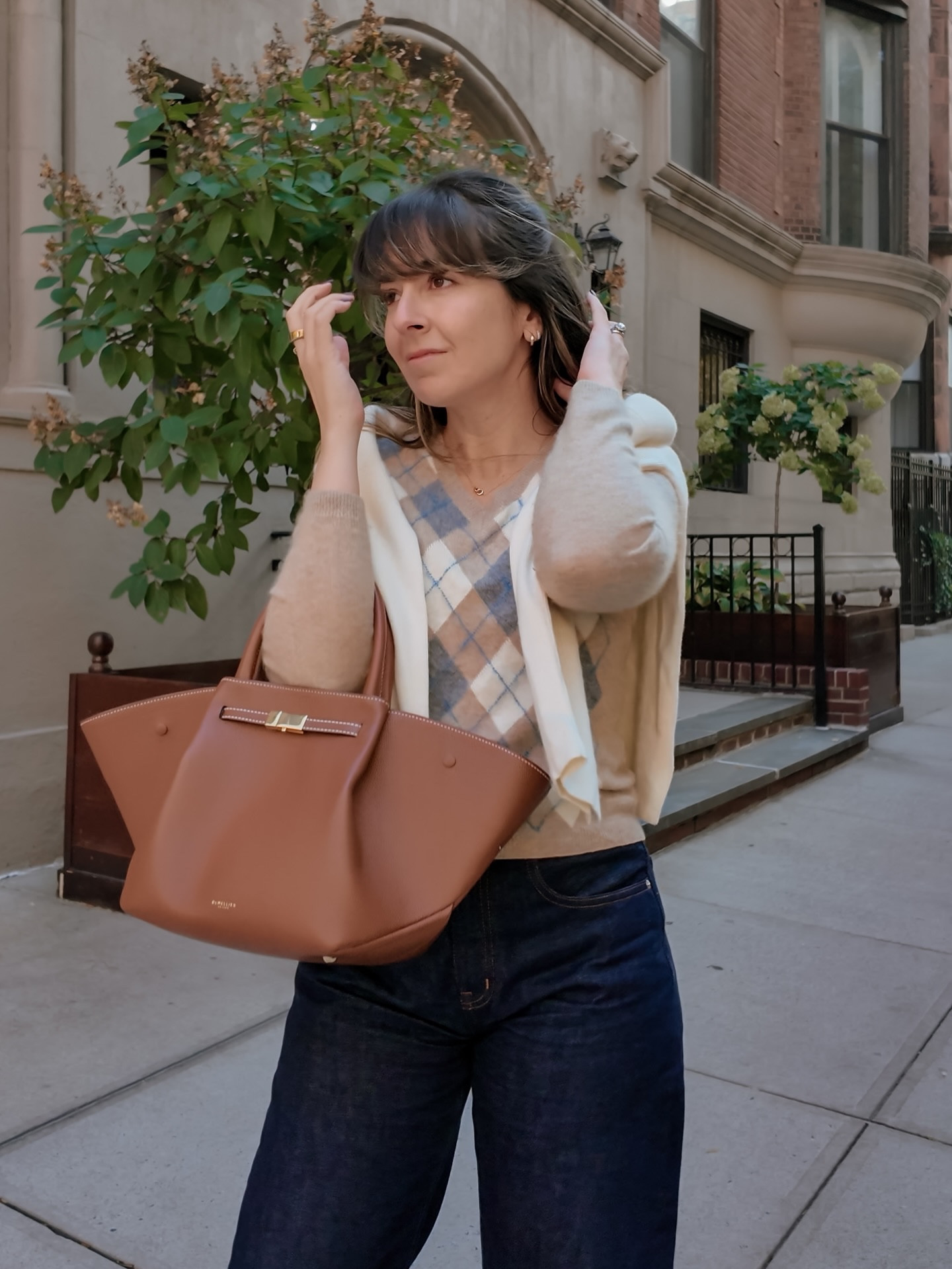 november rolls in with sweater weather & preppy vibes 🍂✨ this fall look is giving all the classic feels: an argyle cashmere knit, with an ivory layer for extra warmth, dark denim, and caramel ballet flats that pair perfectly with those golden leaves. 🍁

#FallFashion #PreppyStyle #NYCFall #OutfitInspo #CozyChic