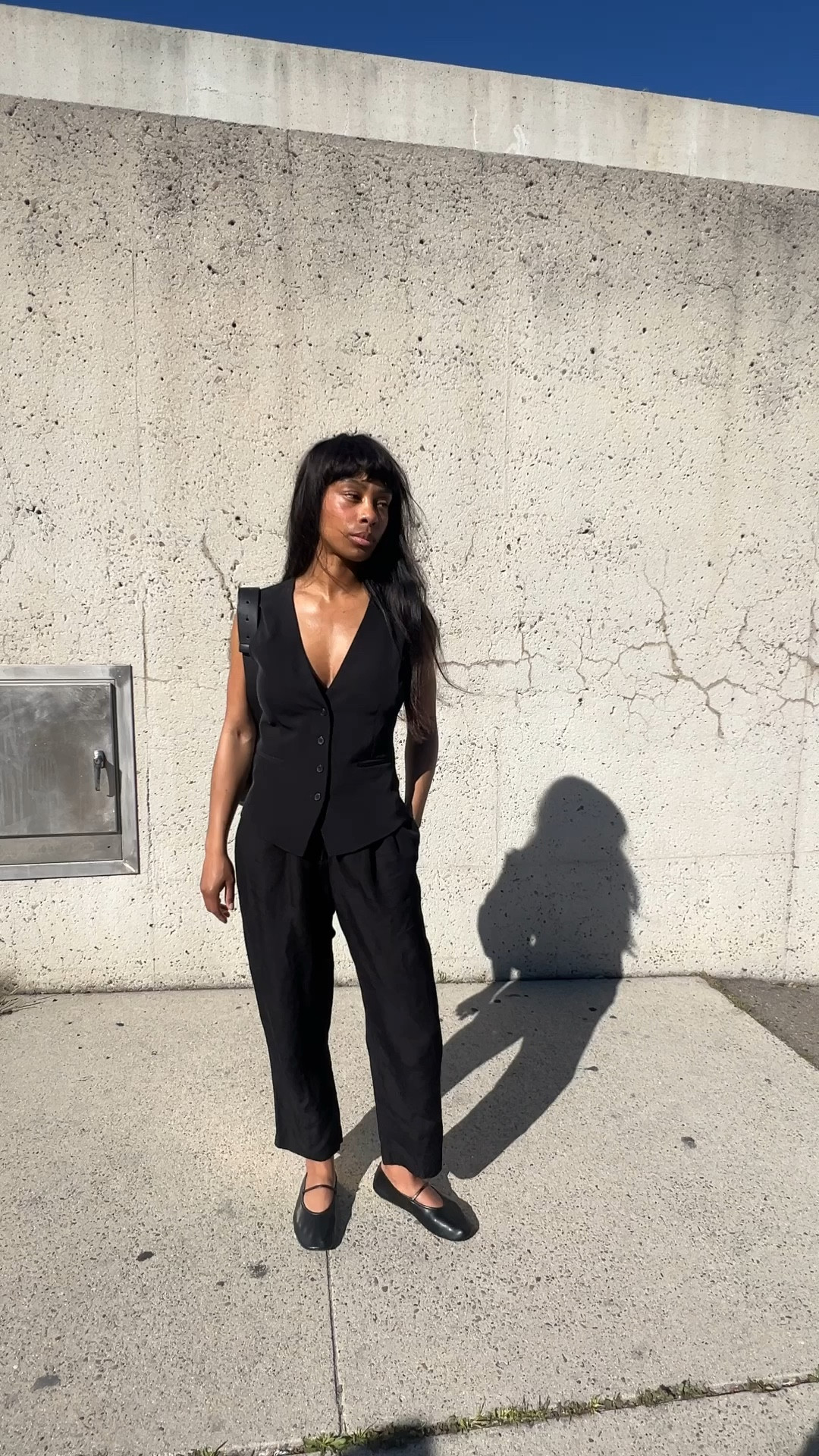 black vest, blank pants, black flats, black bag.

#LTKstyletip #LTKfindsunder50 #LTKitbag