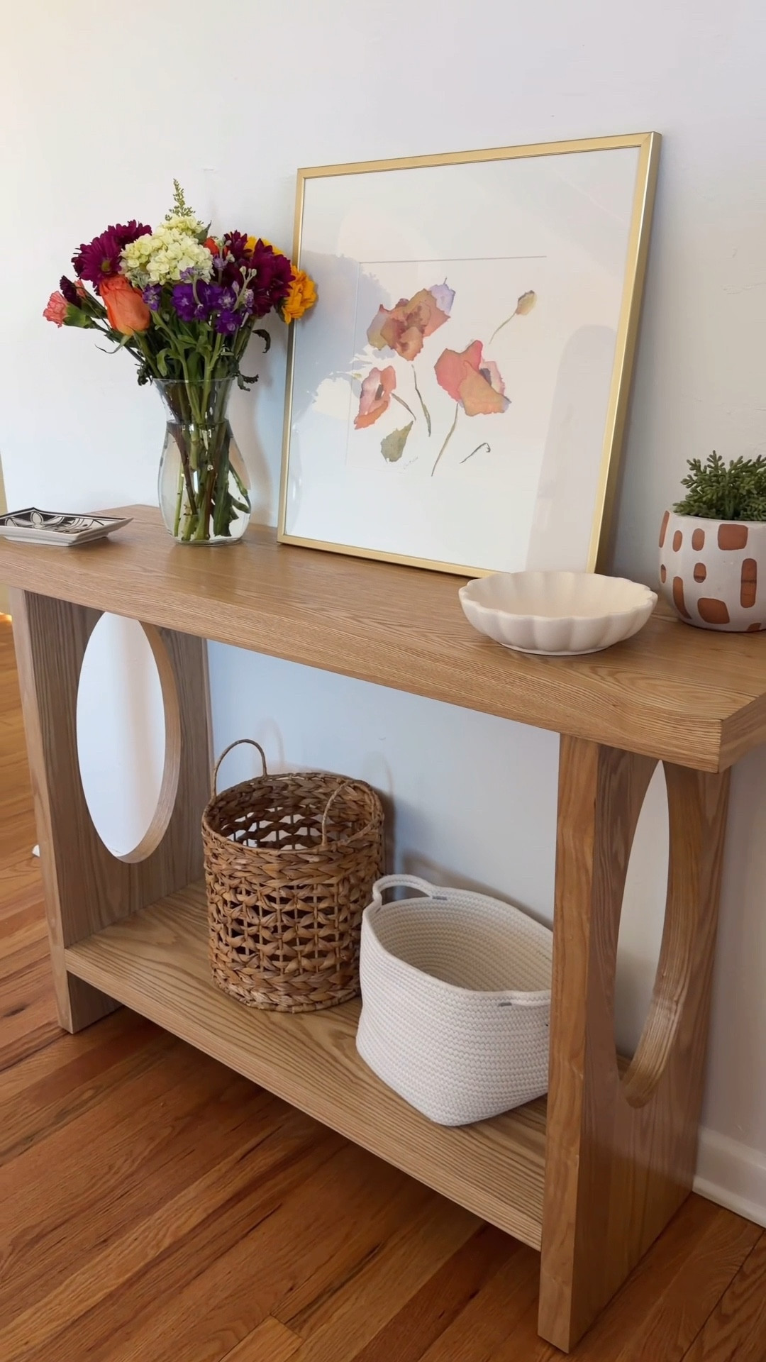 Easy as 1,2,3.  Functional & pretty!  Tips: Add favorite artwork, something tall (faux or real flowers in a vase), a plant, pretty decorative bowls that can be used for keys/phones, baskets below for gloves, dog leash, purse, shoes. 

Follow along for more decorating inspiration.  Type “Love” for Links! 
#entrywaytable #stylingtips #prettytable #moderndecorating #ltkhome

#LTKdayinmylife #LTKSeasonal #LTKHome